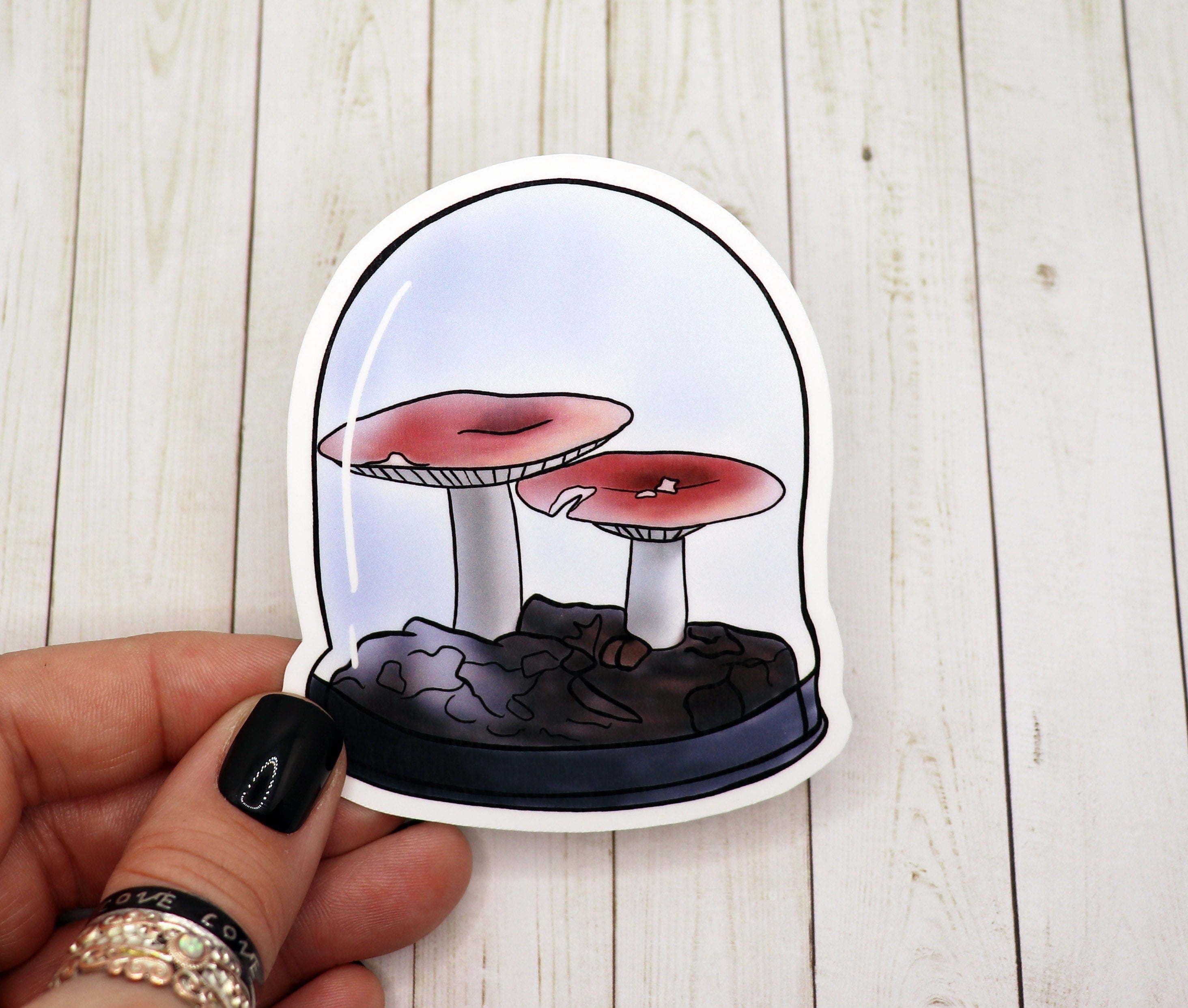 A colorful mushrooms sticker on a white background, showcasing vibrant colors and intricate details.