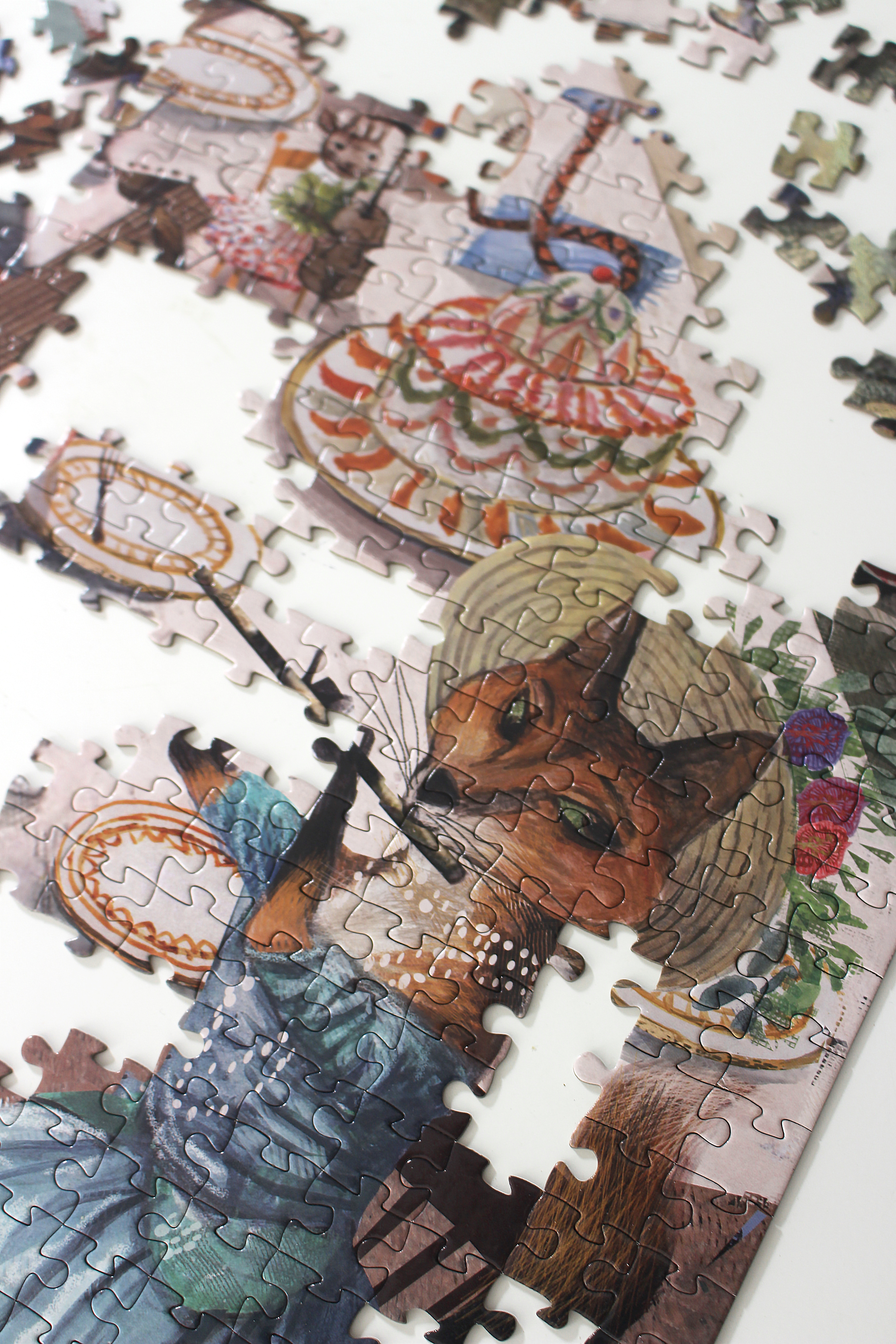 Musical Mosaic jigsaw puzzle featuring colorful pieces depicting a whimsical birthday celebration with musical guests.