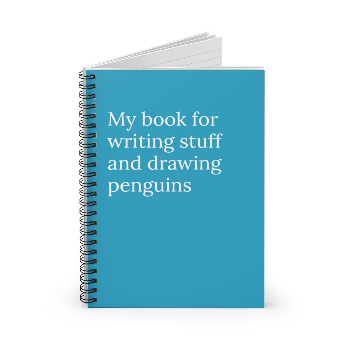 Spiral notebook with a colorful front cover featuring penguins, 118 ruled pages, and a black back cover.