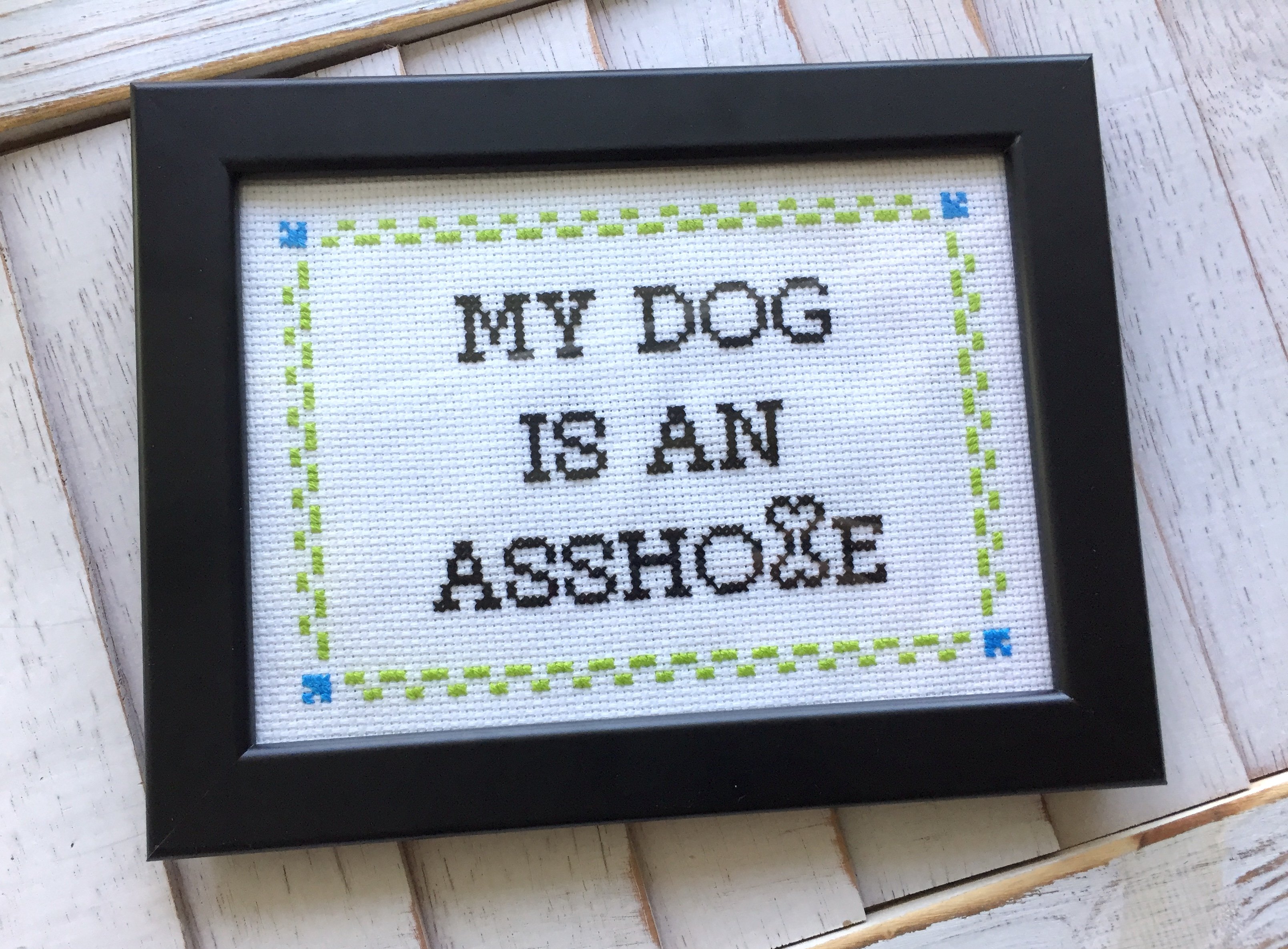 My DOG is an A**hole Cross Stitch DIY Kit featuring a humorous design for dog lovers, including all necessary materials for crafting.