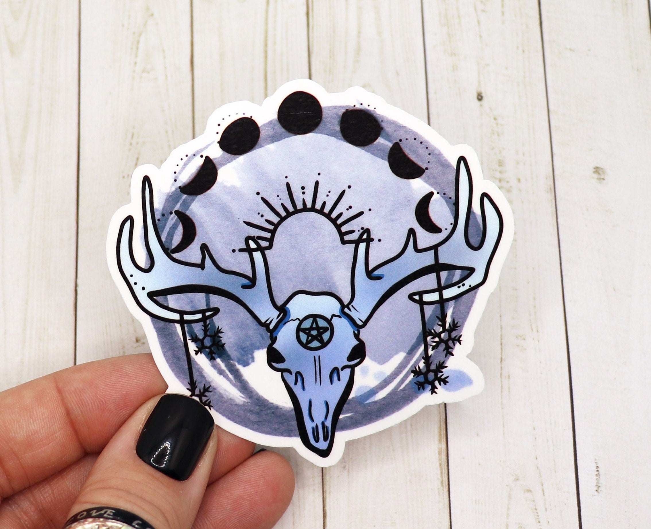 A mystical stag skull sticker featuring intricate details and a matte finish, perfect for personalizing various items.