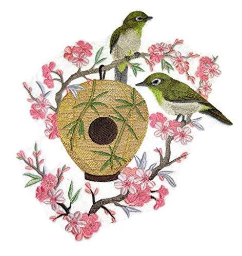 Nest Japanese White-Eye embroidered patch featuring a bird and birdhouse design, ideal for iron-on or sewing applications.