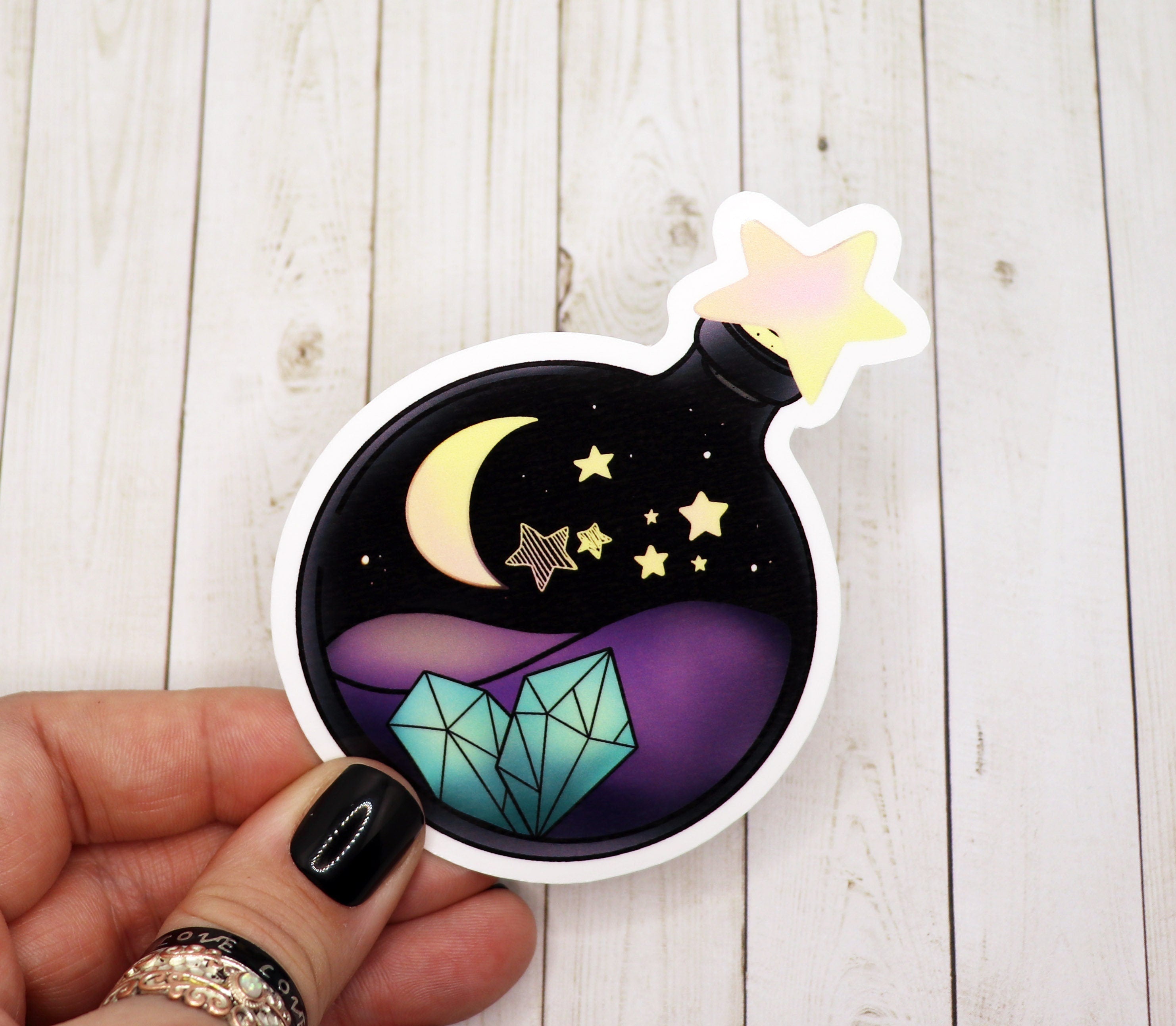 Night Crystal Potion Bottle Sticker featuring a whimsical potion bottle design with night-themed elements.