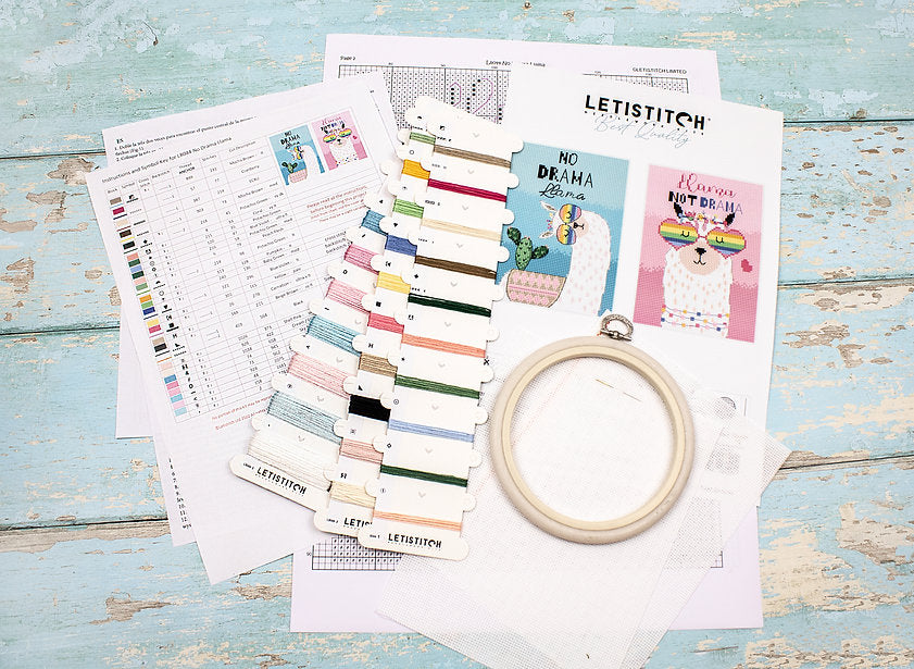 No Drama Llama L8044 Counted Cross Stitch Kit featuring colorful threads, Aida canvas, and detailed instructions.