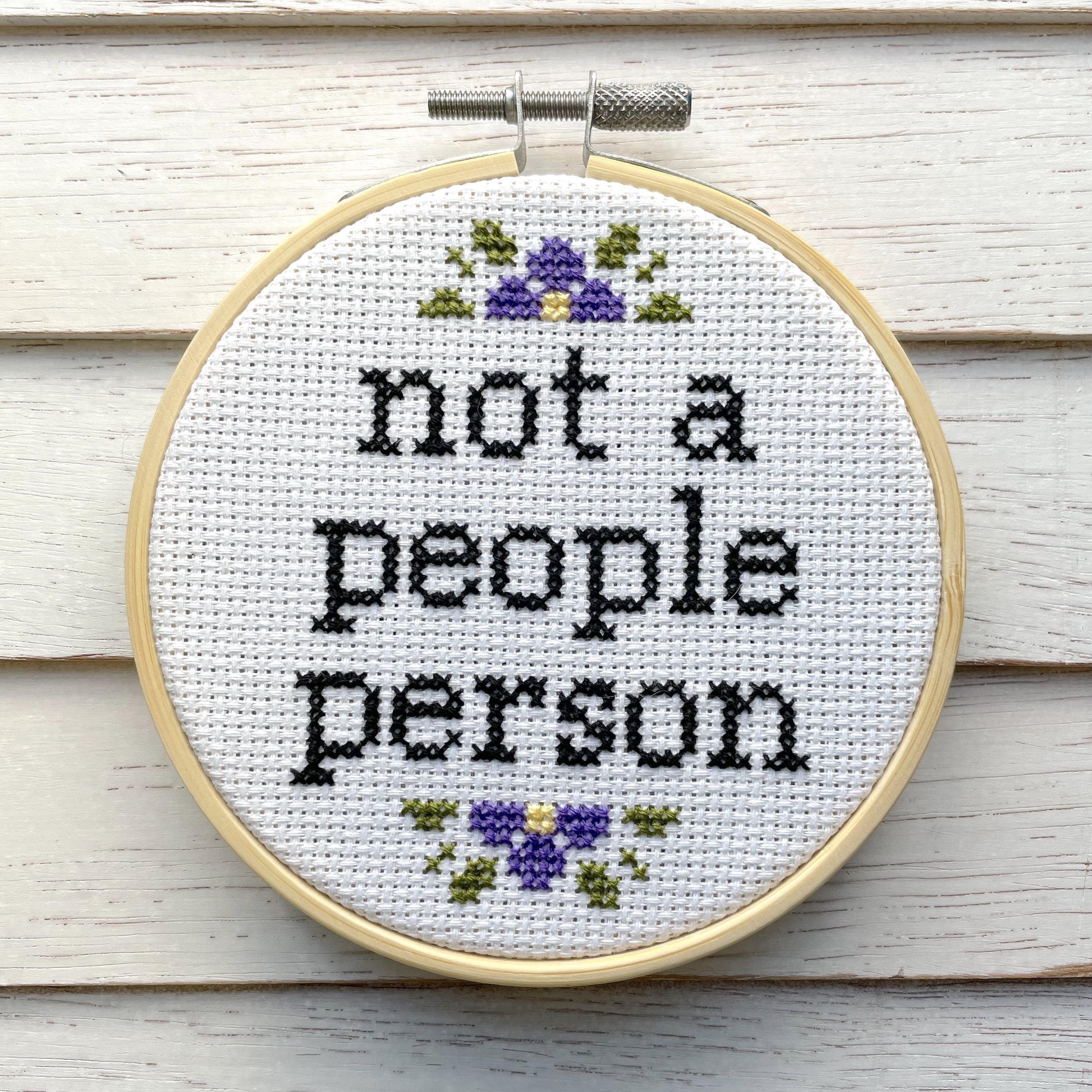 Not a People Person Cross Stitch Kit featuring a humorous design with materials included for crafting.