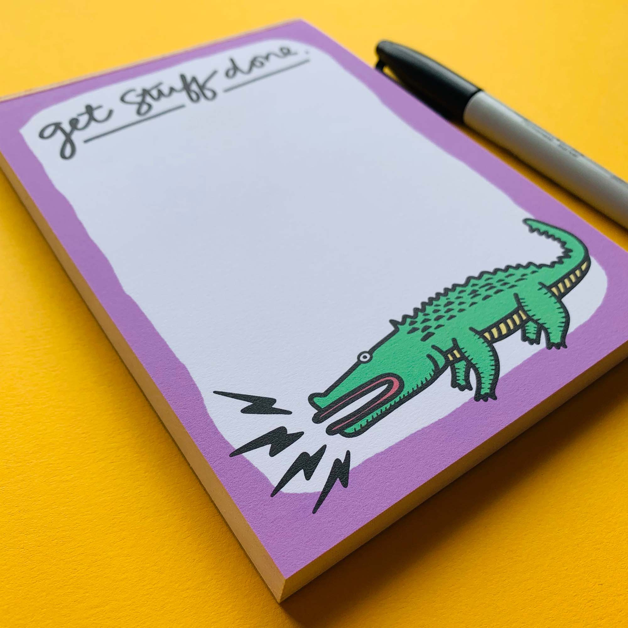 A cute alligator-themed notepad designed for to-do lists, featuring 100 pages of uncoated paper in a compact 5x7 size.