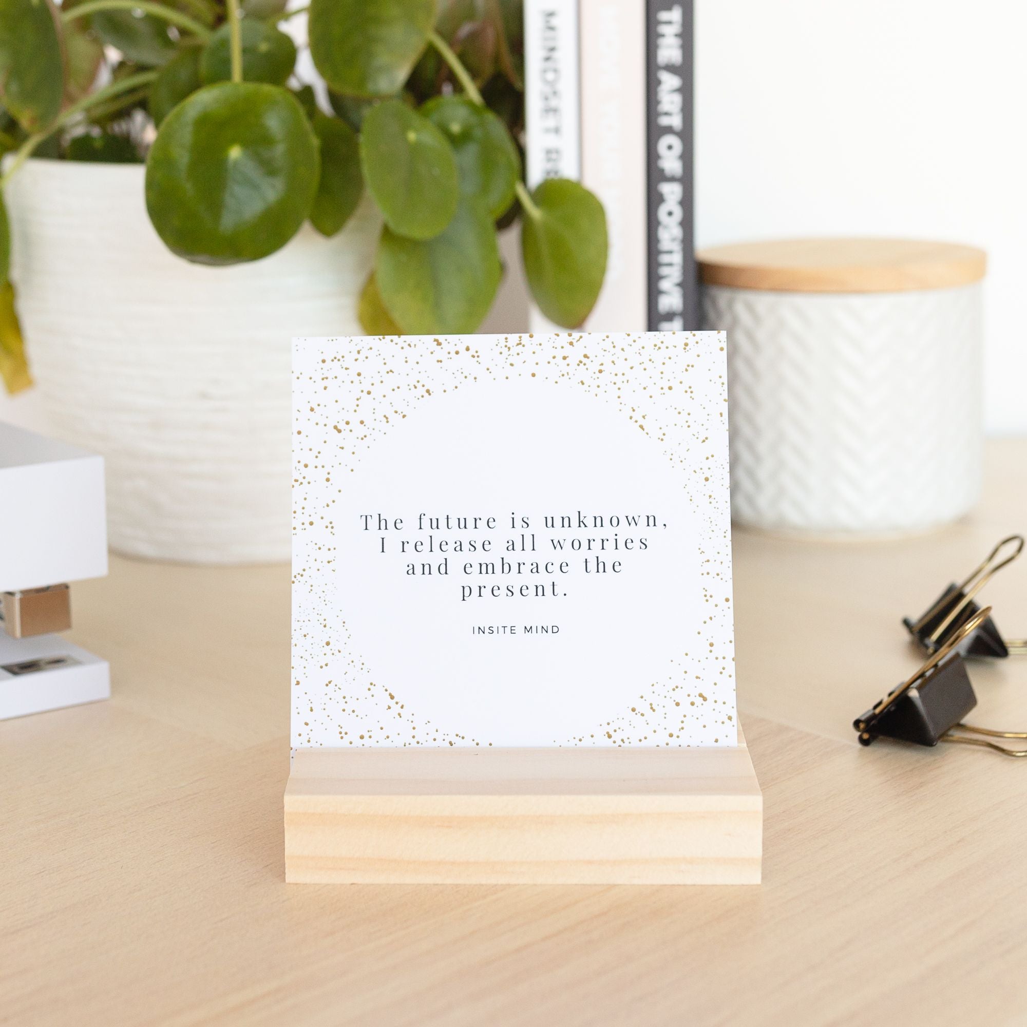 A beautifully designed set of Oh Happy Life affirmation cards displayed with a stylish card stand, featuring positive messages for daily inspiration.