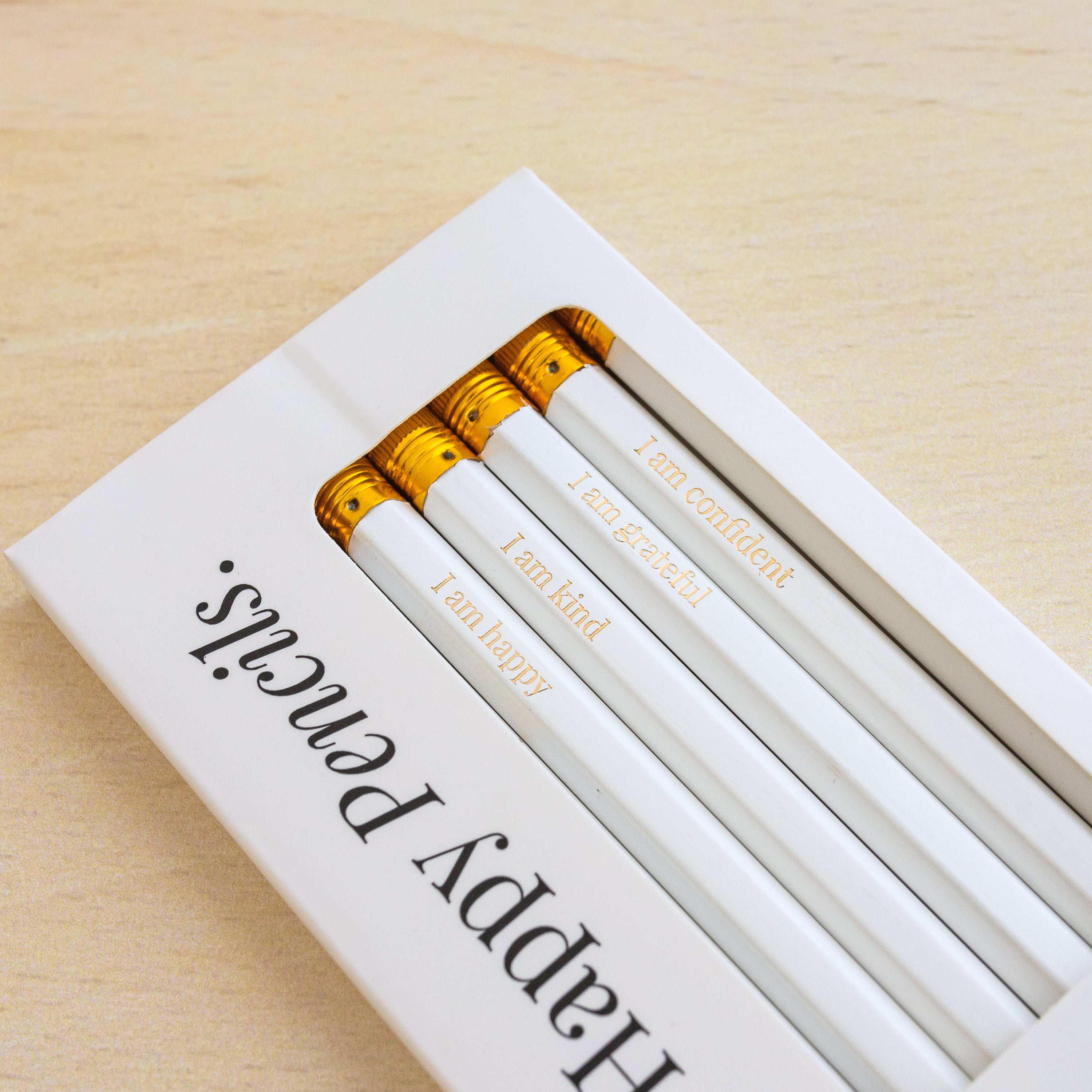 A colorful set of 8 HB affirmation pencils with positive messages like 'I am strong' and 'I am creative', perfect for inspiring writing.