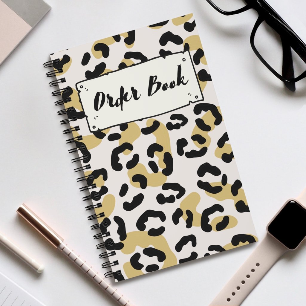 A5 Order Book featuring 23 animal print cover designs, showcasing vibrant and stylish laminated covers.