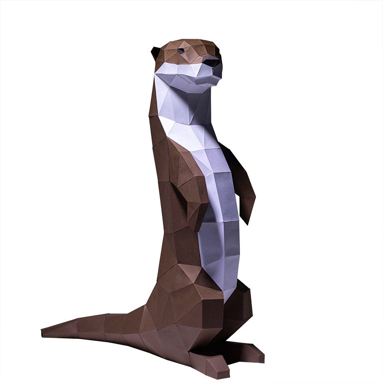 A charming self-standing otter figurine made from 3D kirigami paper, showcasing its playful design and intricate details.