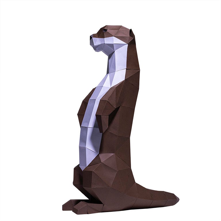 A charming self-standing otter figurine made from 3D kirigami paper, showcasing its playful design and intricate details.