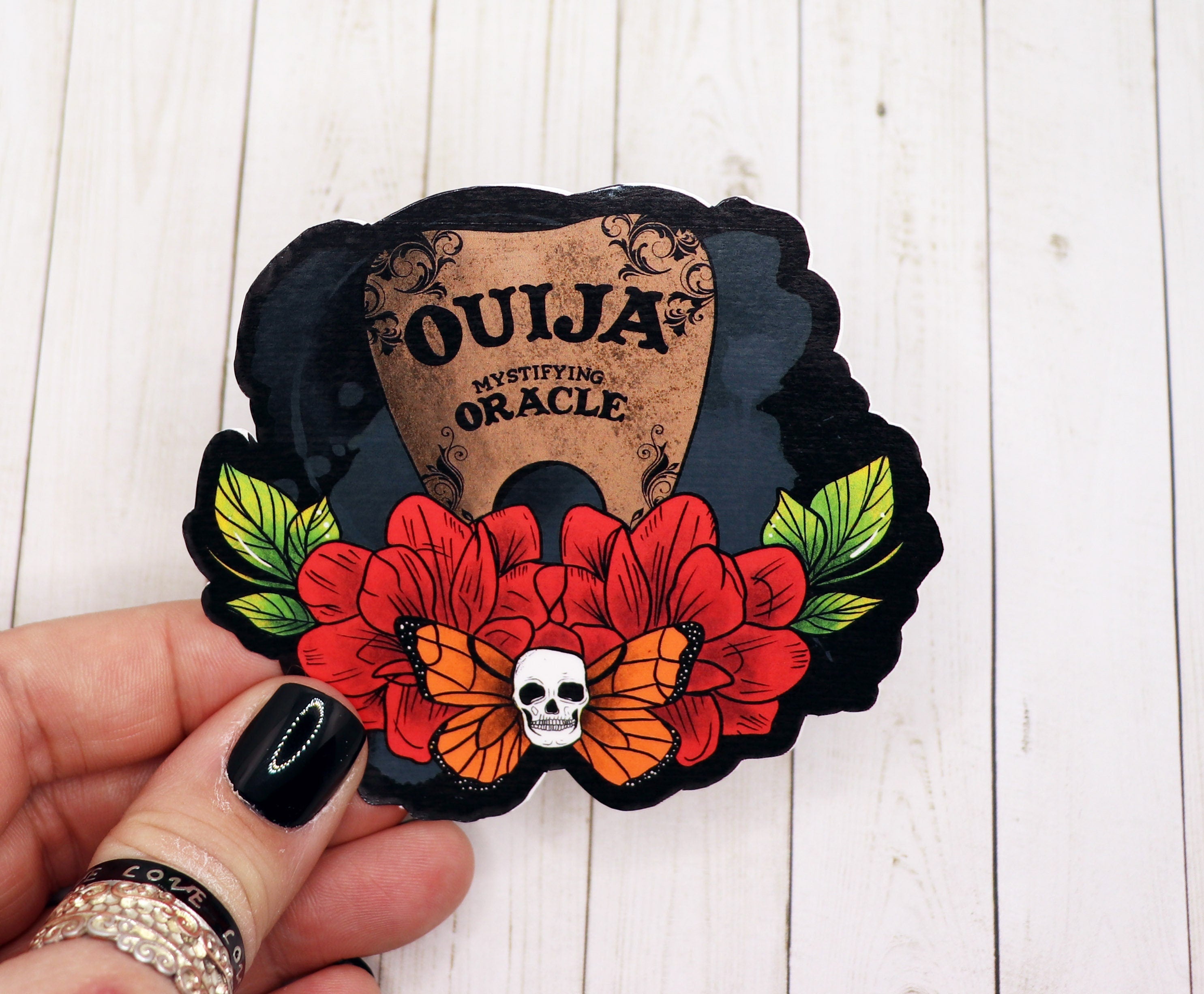 Ouija Board Planchette Sticker on a white background, showcasing its intricate design and matte finish.