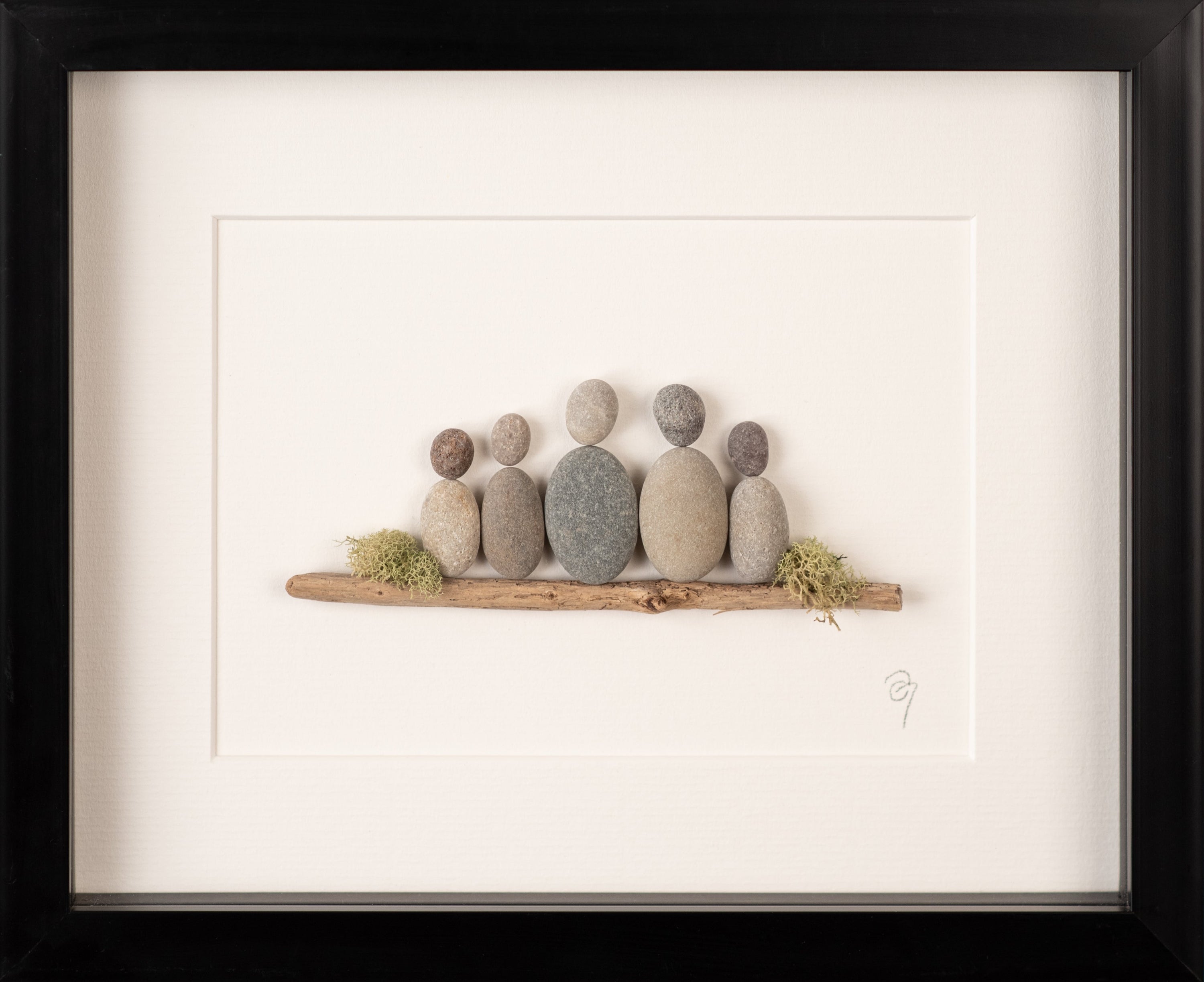 A beautifully framed artwork representing a family of four, showcasing unique, nature-inspired designs in a white or black frame.