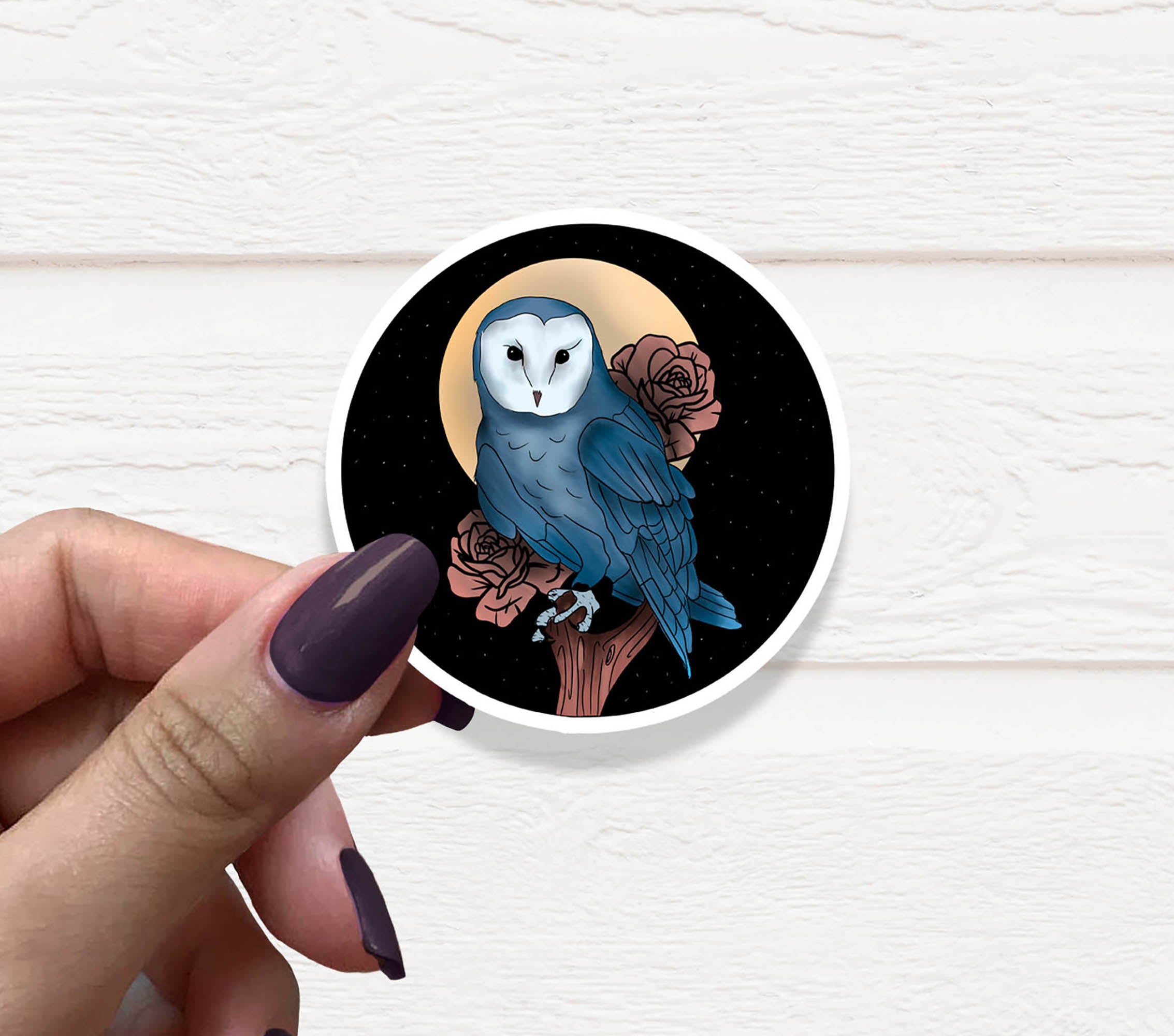 A colorful owl vinyl sticker on a white background, showcasing its intricate design and matte finish.