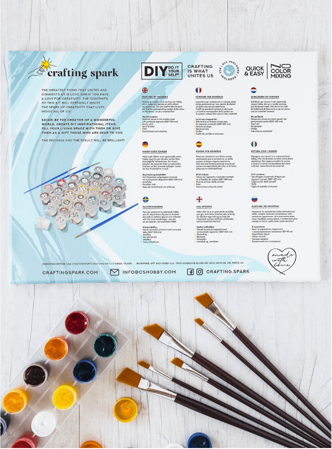 Crafting Spark Painting by Numbers kit featuring a polygonal wolf design on a stretched canvas, complete with acrylic paints and brush.