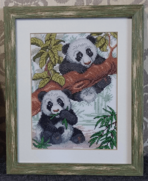 Pandas SM-050 Counted Cross Stitch Kit featuring 14 count AIDA canvas, cotton threads, and a needle, designed by Anzhelika Ivanova.