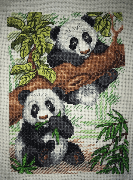 Pandas SM-050 Counted Cross Stitch Kit featuring 14 count AIDA canvas, cotton threads, and a needle, designed by Anzhelika Ivanova.