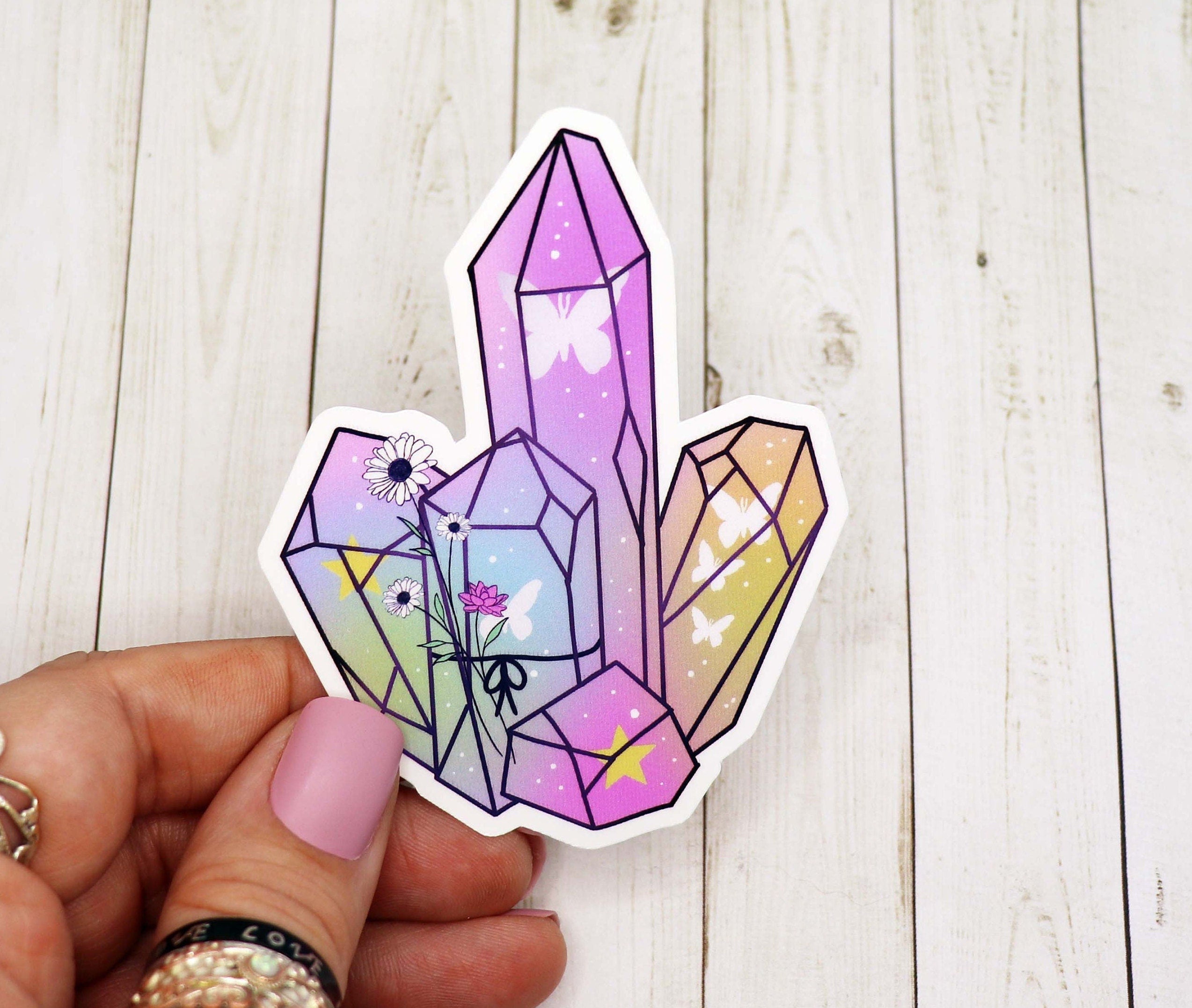 A vibrant pastel crystal vinyl sticker showcasing a beautiful design, perfect for personalizing various items.