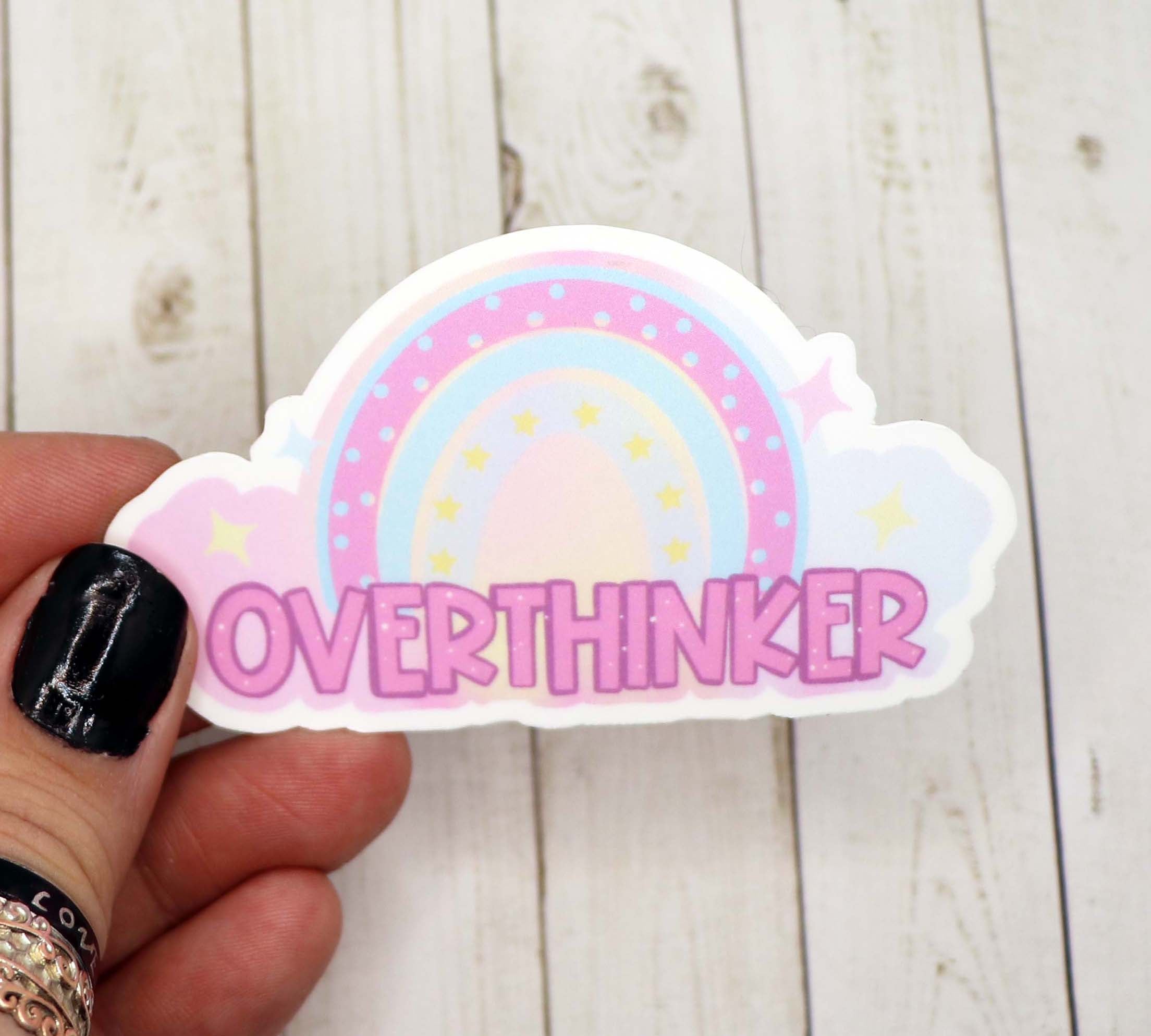 A pastel-colored sticker featuring the phrase 'Overthinker' in a stylish font, perfect for personalizing items.