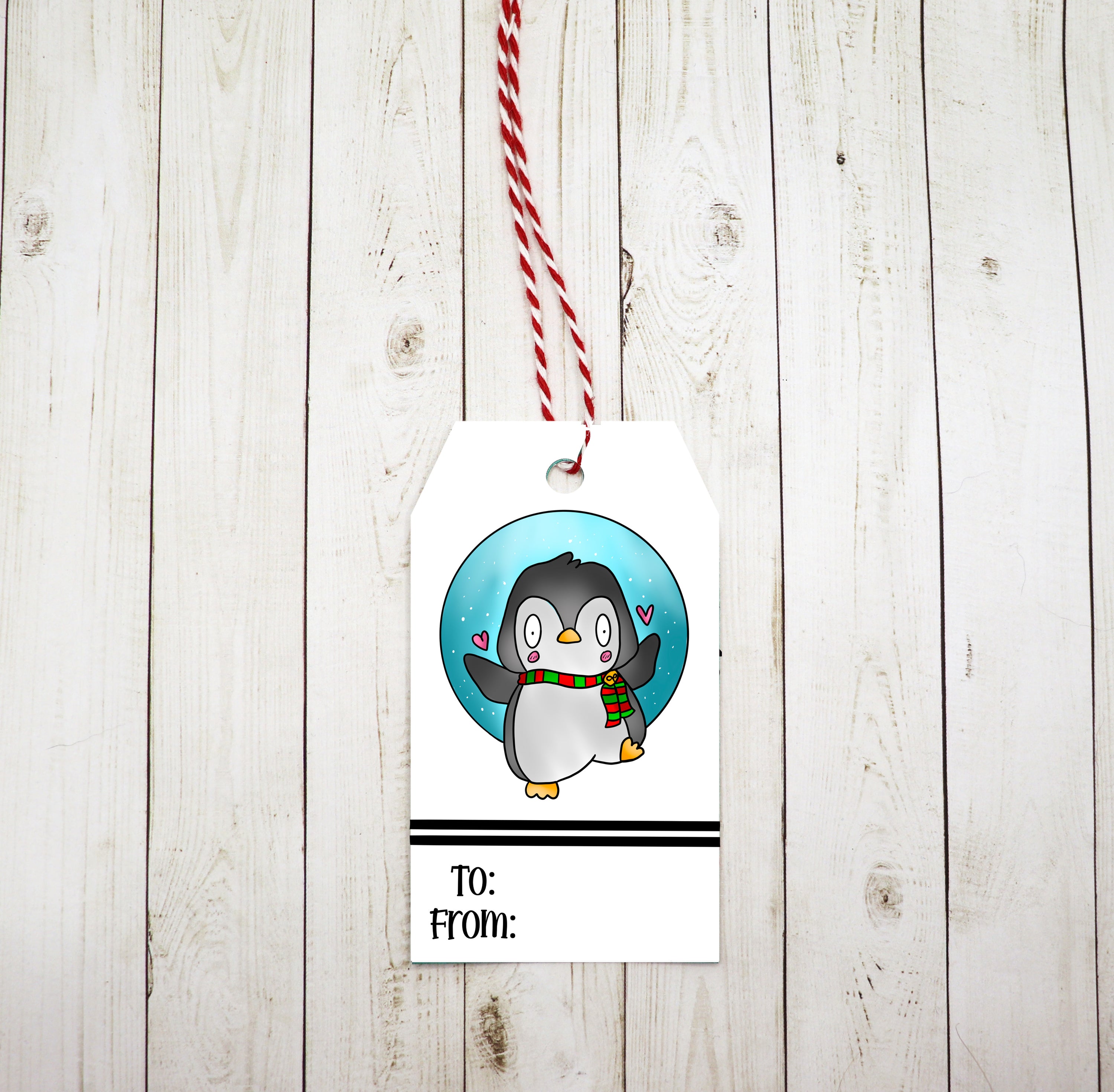 A set of eight adorable penguin gift tags with red and white twine, printed on heavy white cardstock.