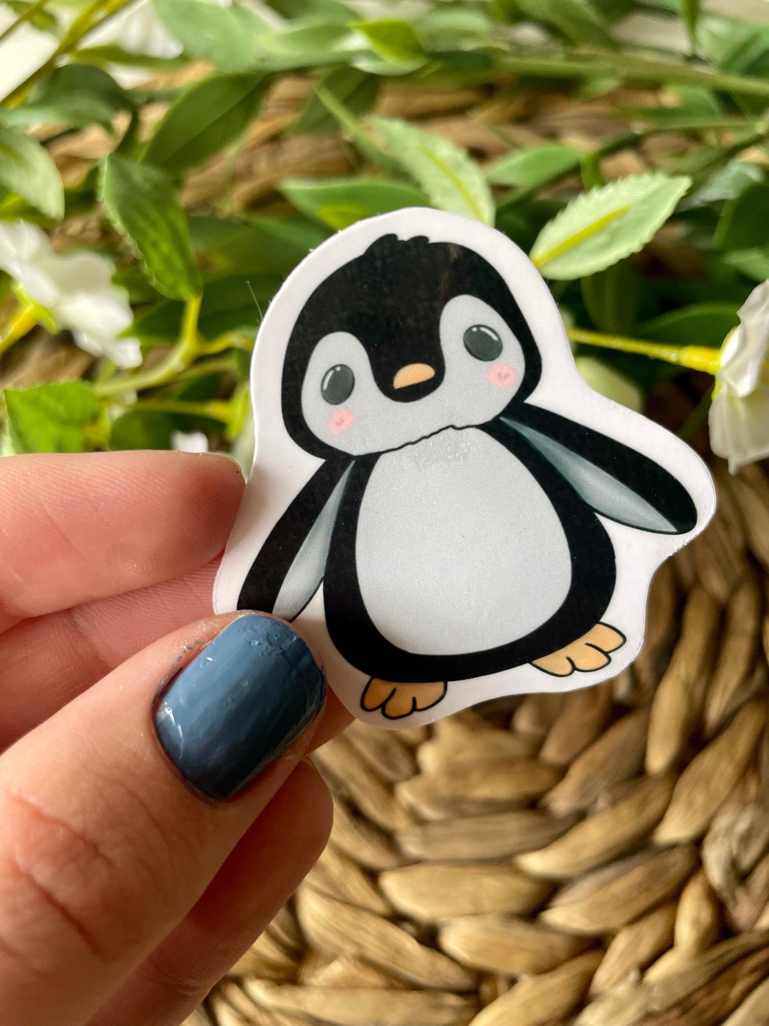 A cute penguin sticker designed for customization, featuring a vibrant penguin illustration on a waterproof background.