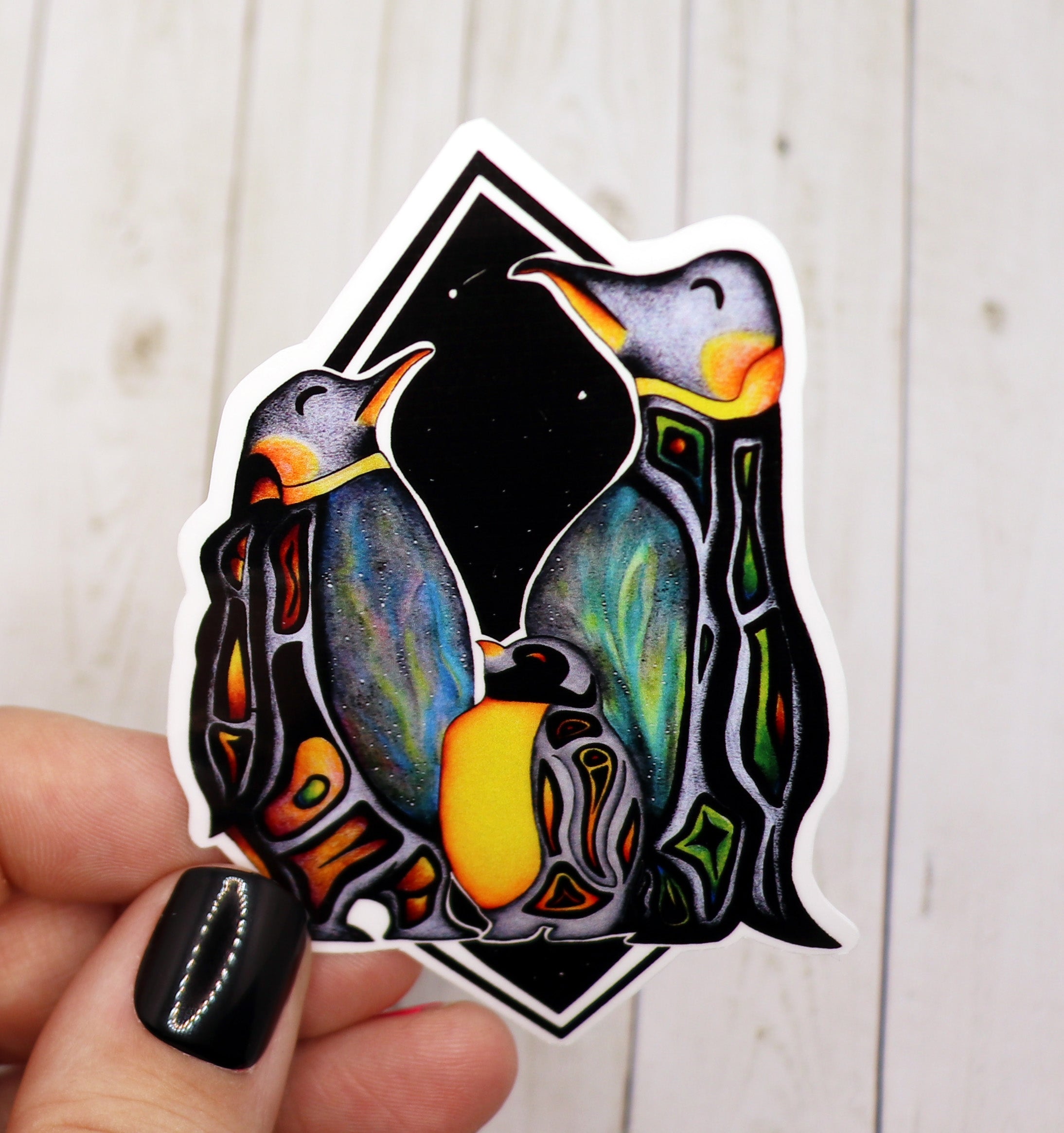 A vibrant Penguin Sticker on a matte vinyl surface, showcasing a cute penguin design.