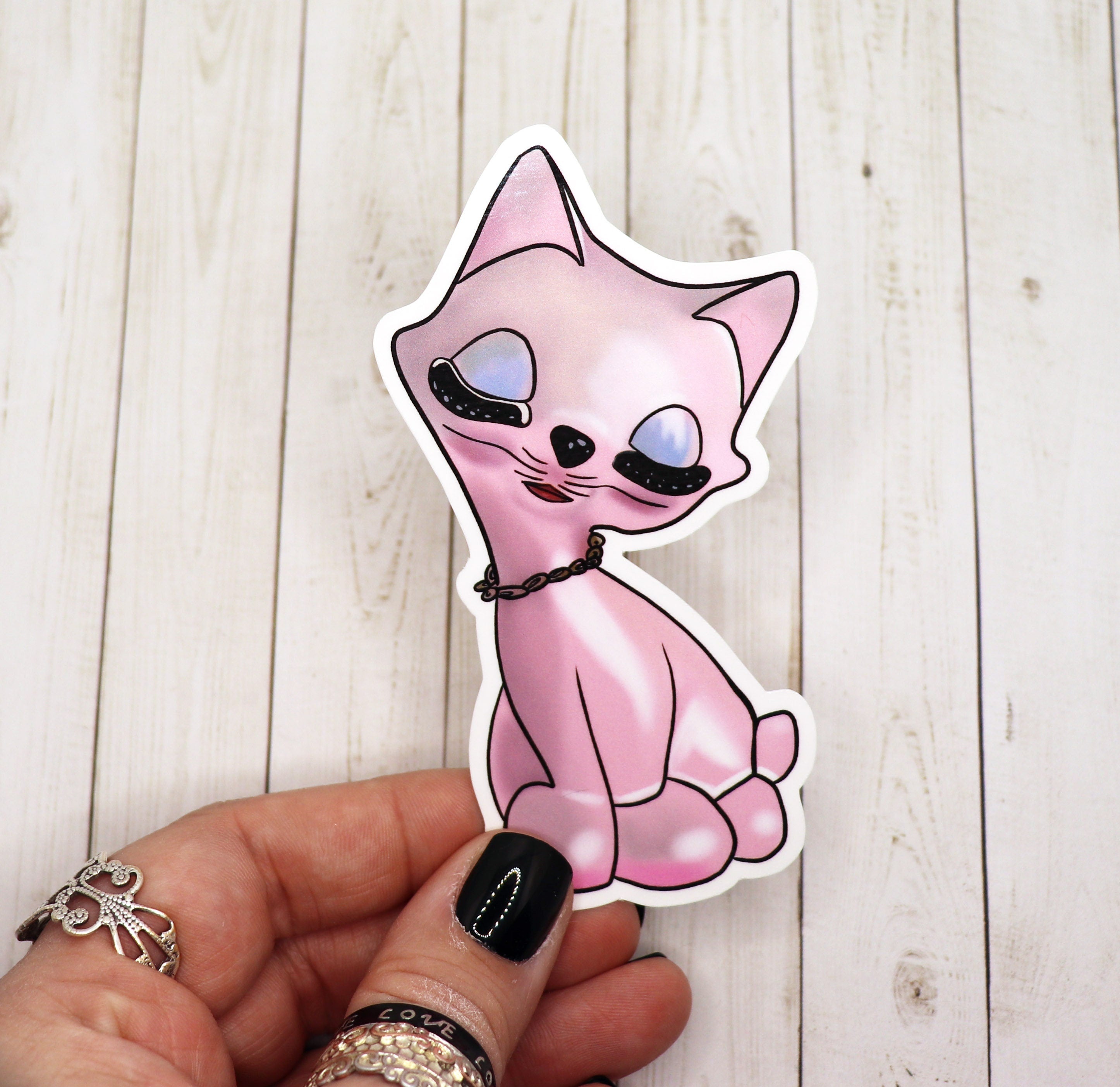 A vibrant Pink Cat Kitschy Sticker featuring a playful cat design, perfect for personalizing various items.