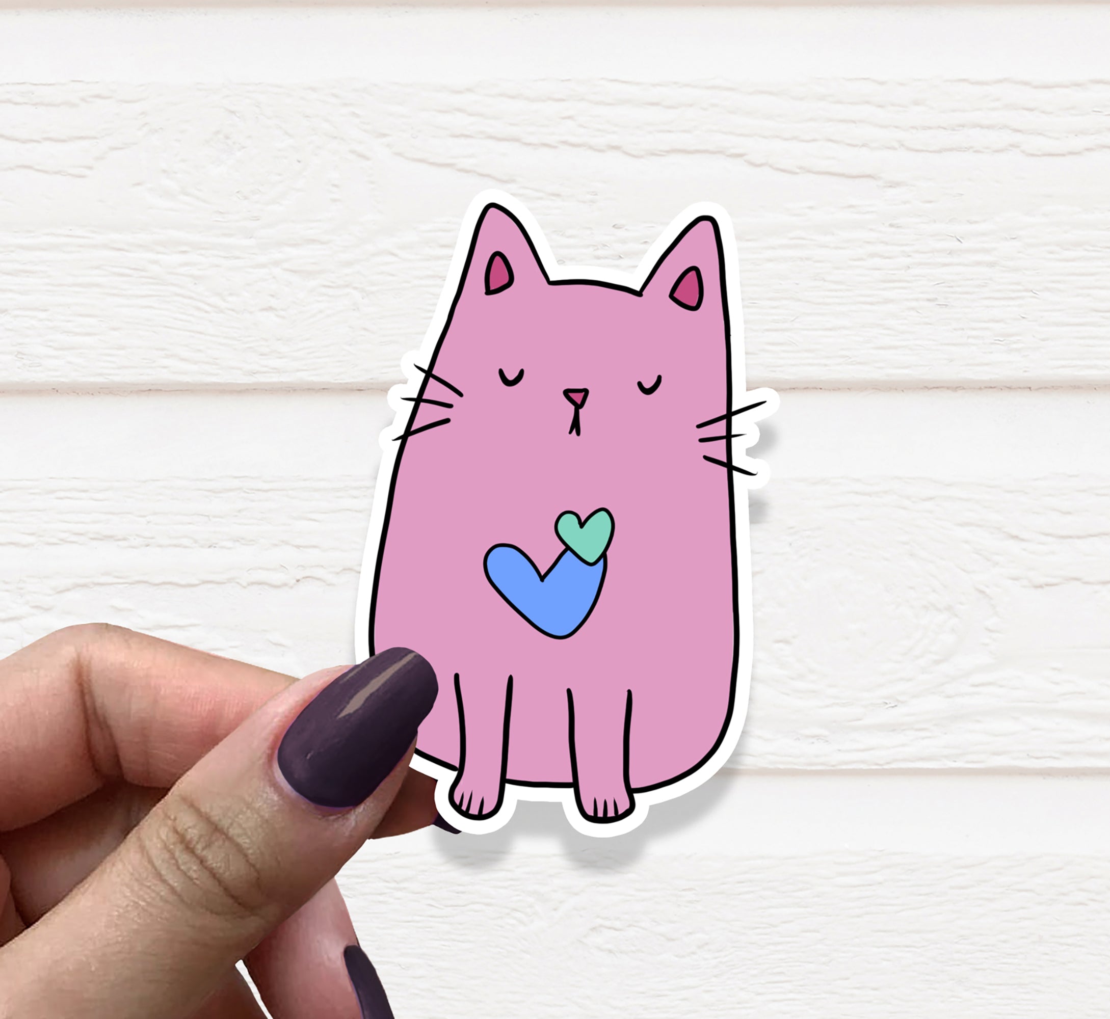 A vibrant pink cat vinyl sticker on a white background, showcasing its cute design and matte finish.