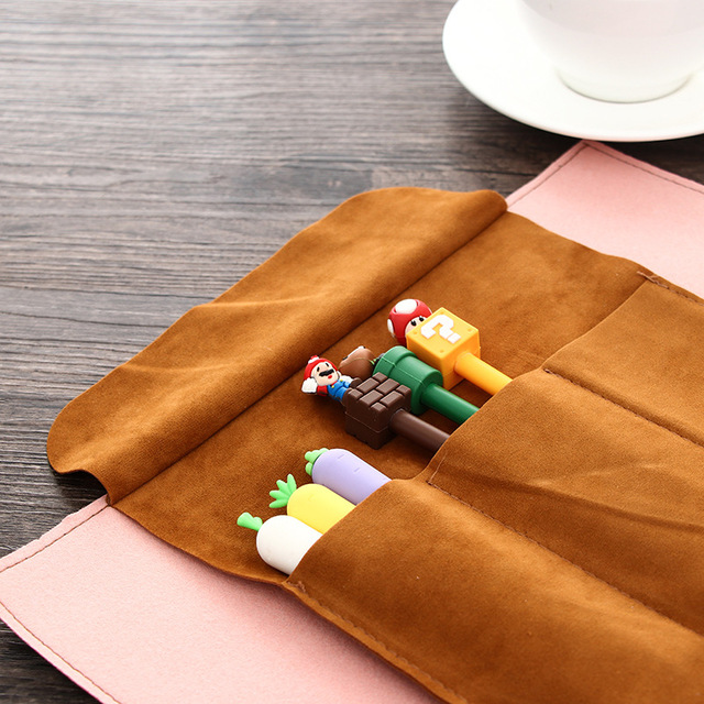 Colorful pens in suede pouch.