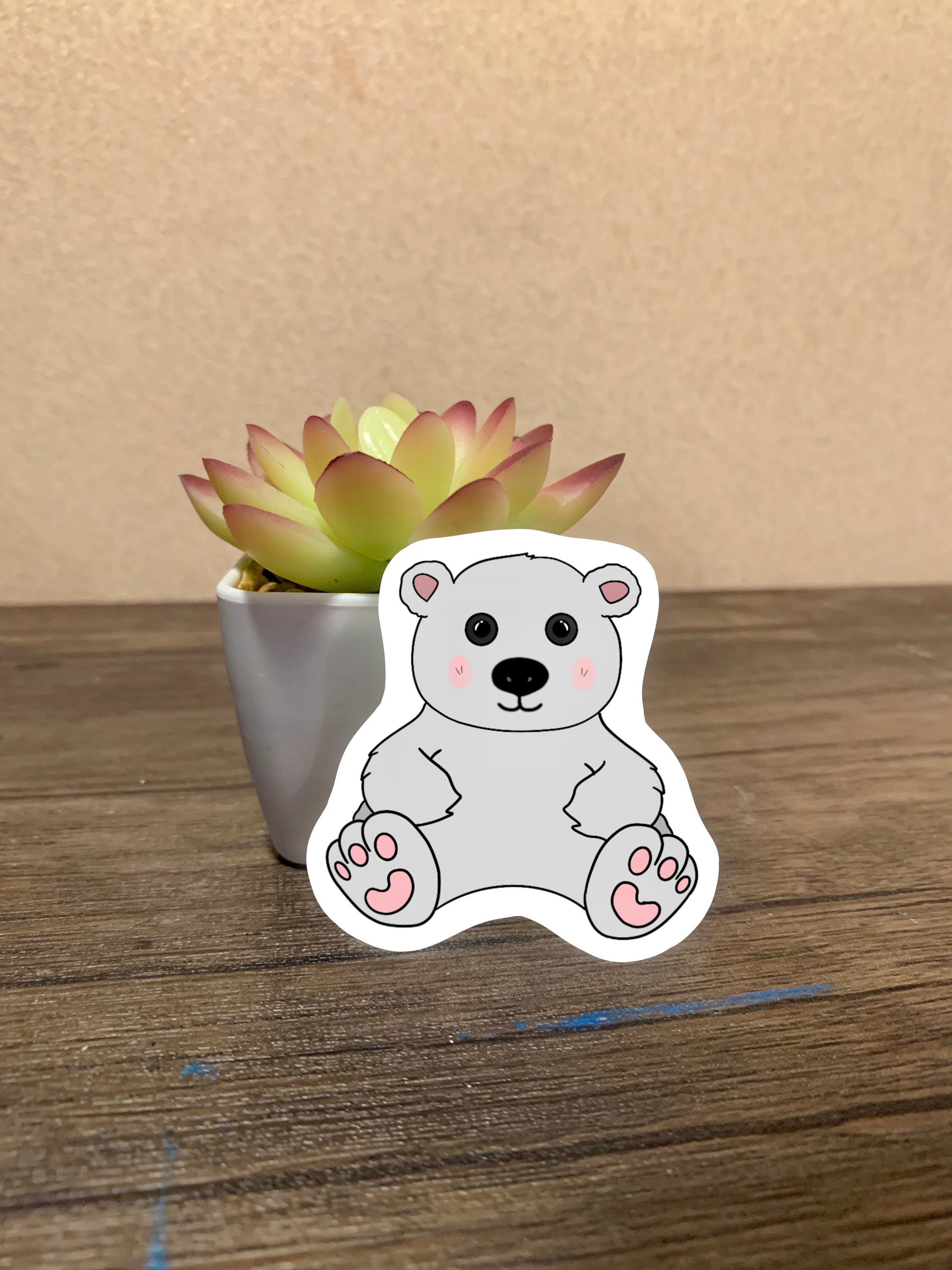 A cute polar bear sticker designed for customization, featuring a charming polar bear illustration on a waterproof background.