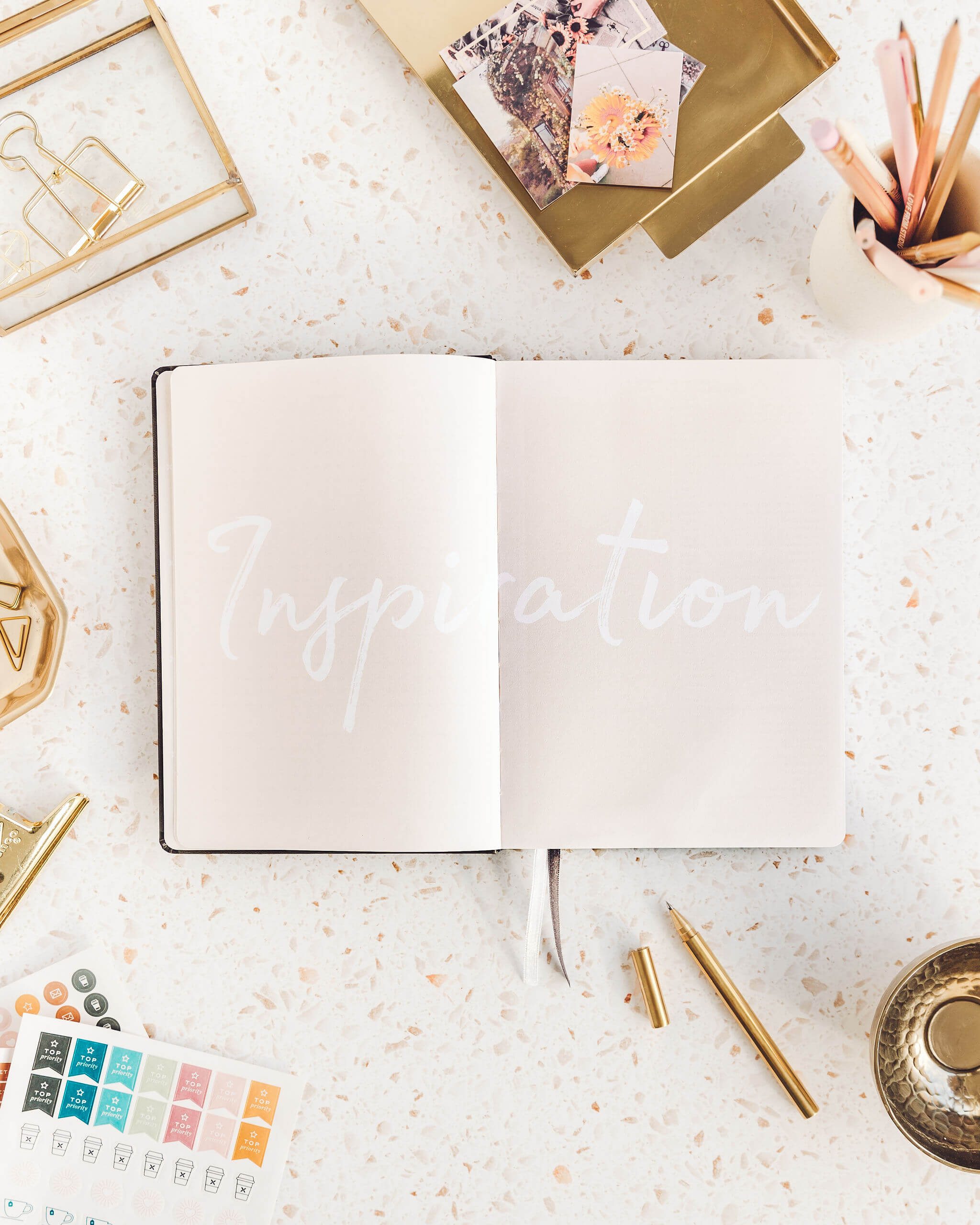 Open notebook with "Inspiration" text.