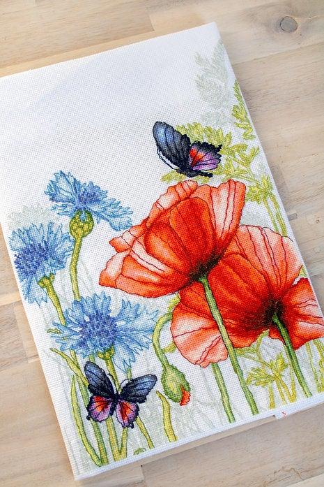 Poppies and Butterflies counted cross-stitch kit featuring vibrant red flowers and butterflies on Aida canvas.