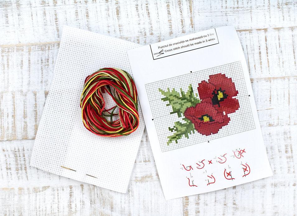 Poppies B023L Counted Cross-Stitch Kit with Aida canvas, Anchor threads, and needle, showcasing vibrant colors and detailed design.