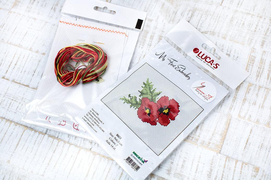 Poppies B023L Counted Cross-Stitch Kit with Aida canvas, Anchor threads, and needle, showcasing vibrant colors and detailed design.