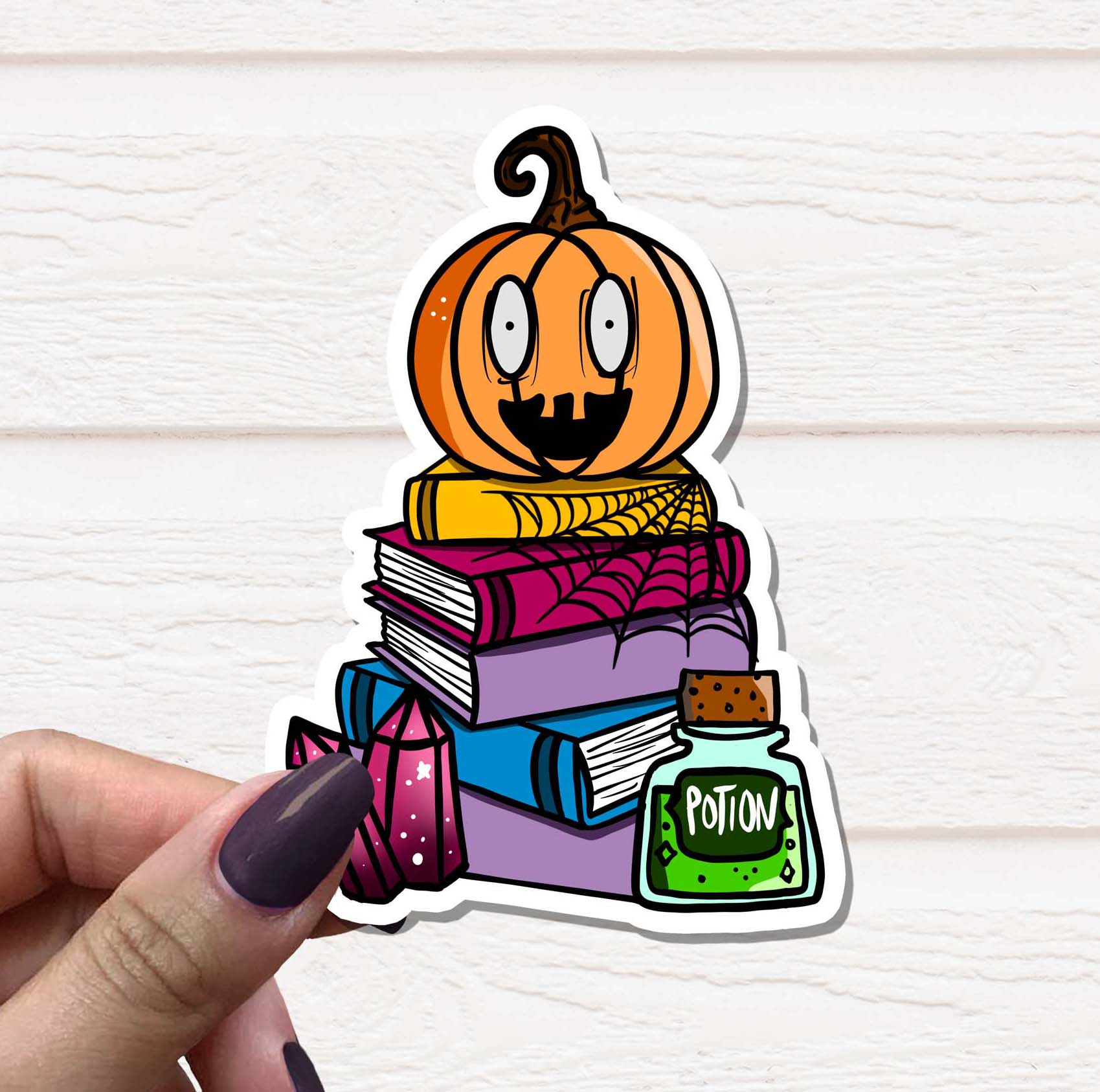 A vibrant Pumpkin Book Stack Vinyl Sticker featuring stacked books and pumpkins, perfect for decorating various surfaces.