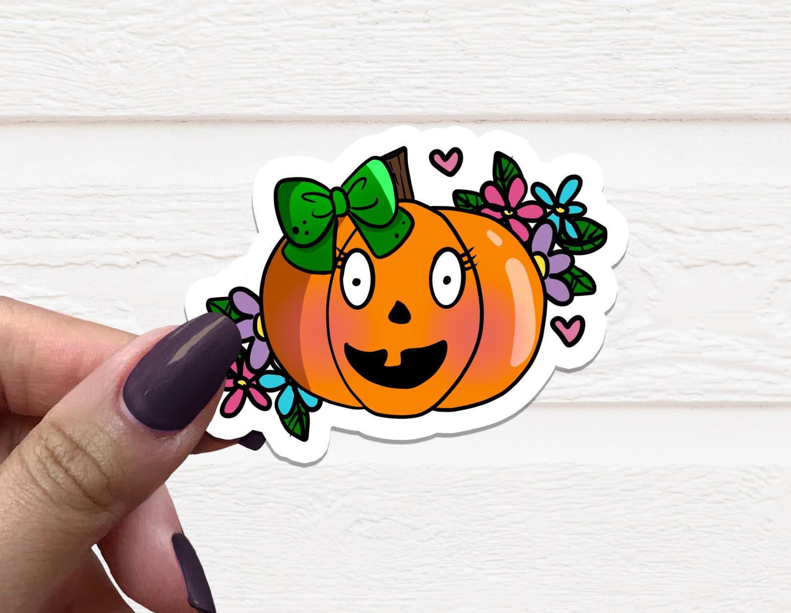 A vibrant Pumpkin Girl Vinyl Sticker featuring a whimsical pumpkin design, perfect for personalizing various items.