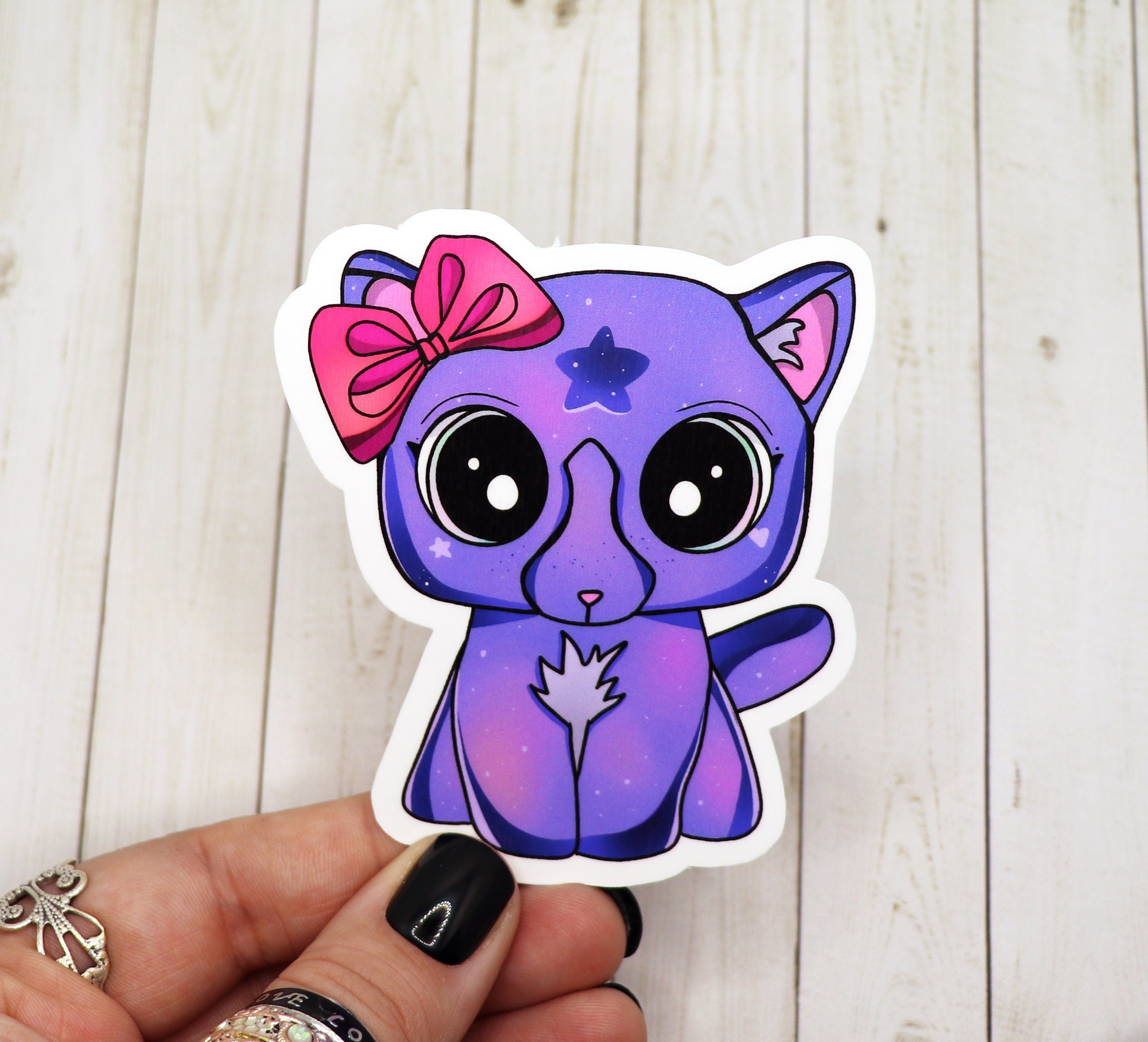 A vibrant purple cat sticker on a white background, showcasing its cute design and high-quality matte finish.