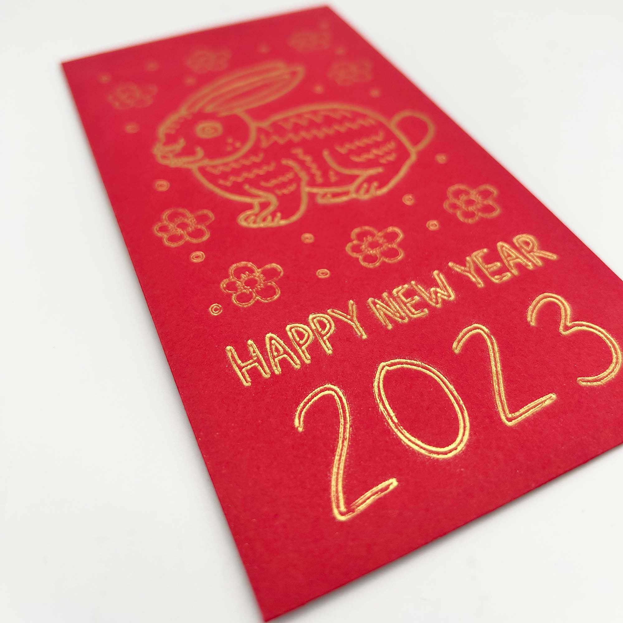 A set of red envelopes featuring a floral rabbit design, symbolizing the Lunar New Year 2023, perfect for gifting lucky money.