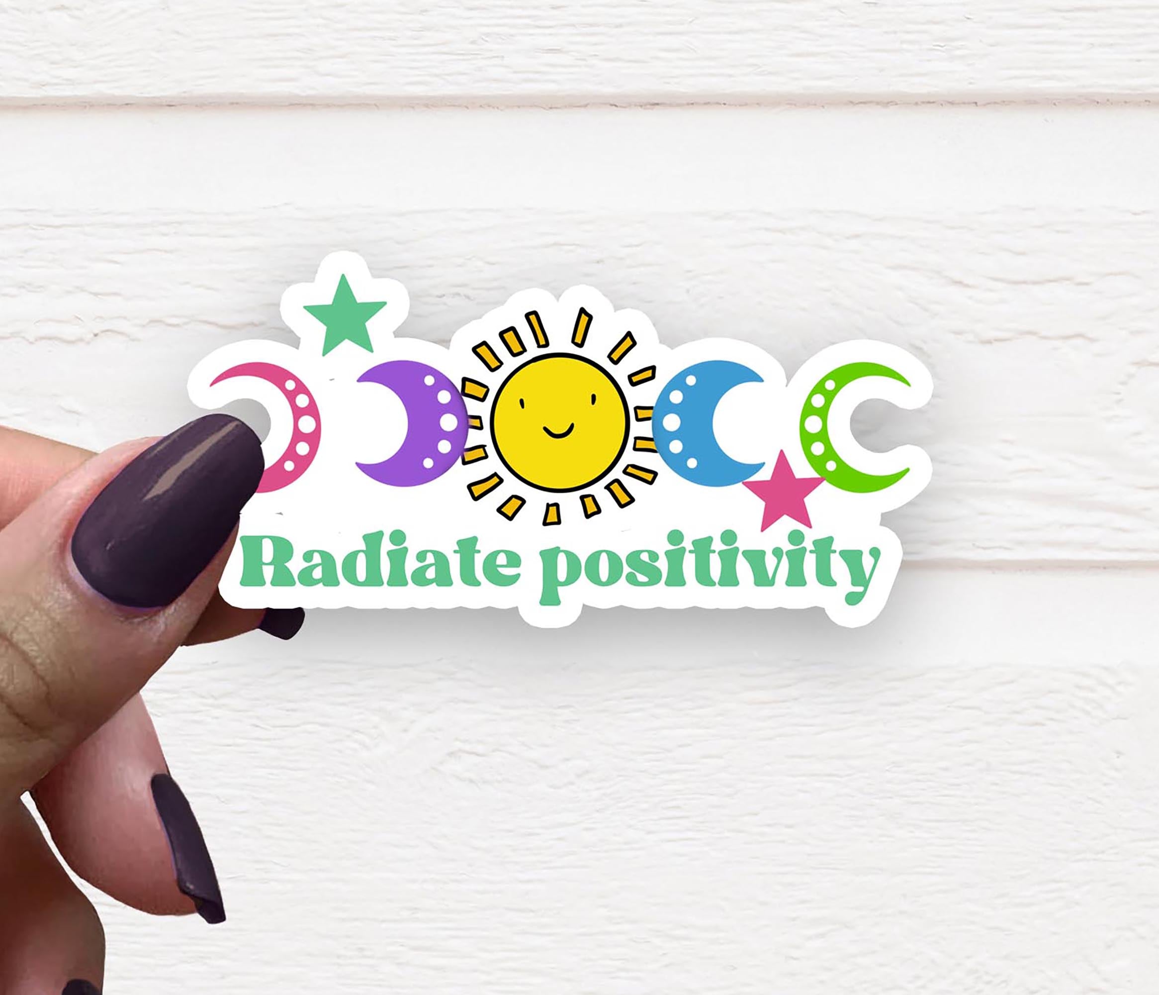 A vibrant 4-inch vinyl sticker featuring the phrase 'Radiate Positivity' in colorful lettering, perfect for personalizing items.