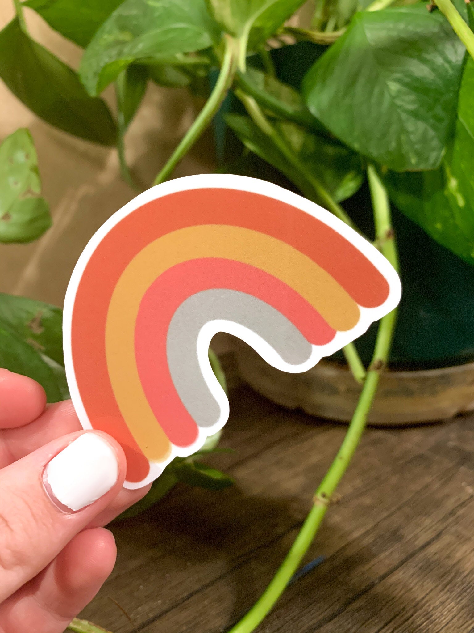 A colorful rainbow sticker designed for customization, featuring vibrant colors and a cute aesthetic, ideal for hydroflasks and laptops.