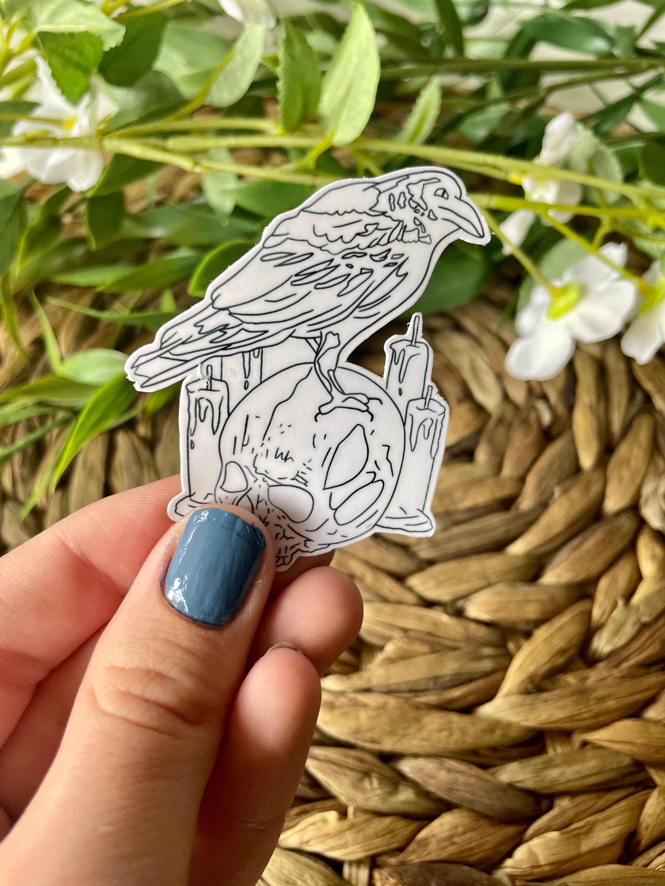 A detailed raven skull sticker featuring intricate designs, perfect for personalizing items like laptops and water bottles.