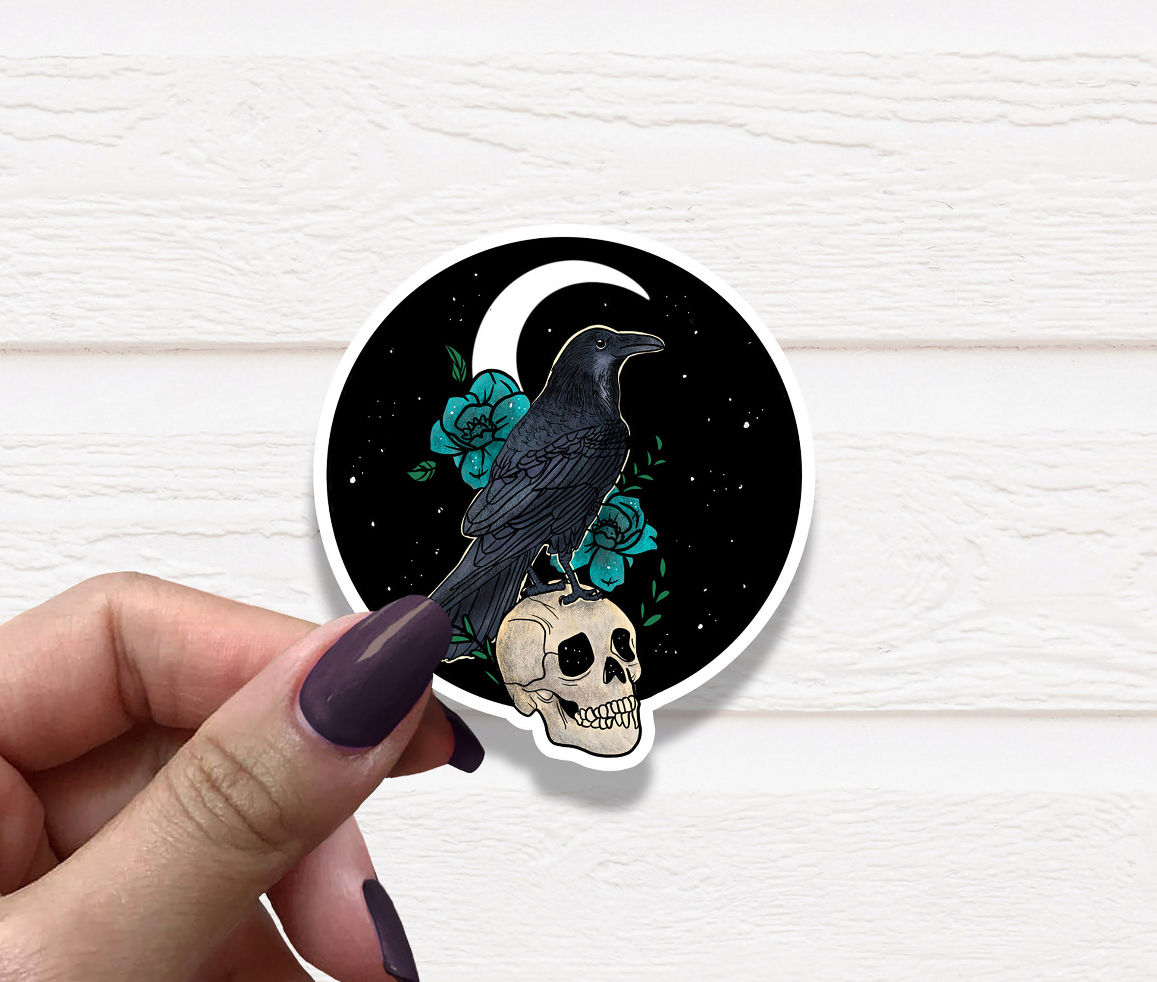 A detailed Raven Vinyl Sticker featuring a sleek design, perfect for personalizing various items.