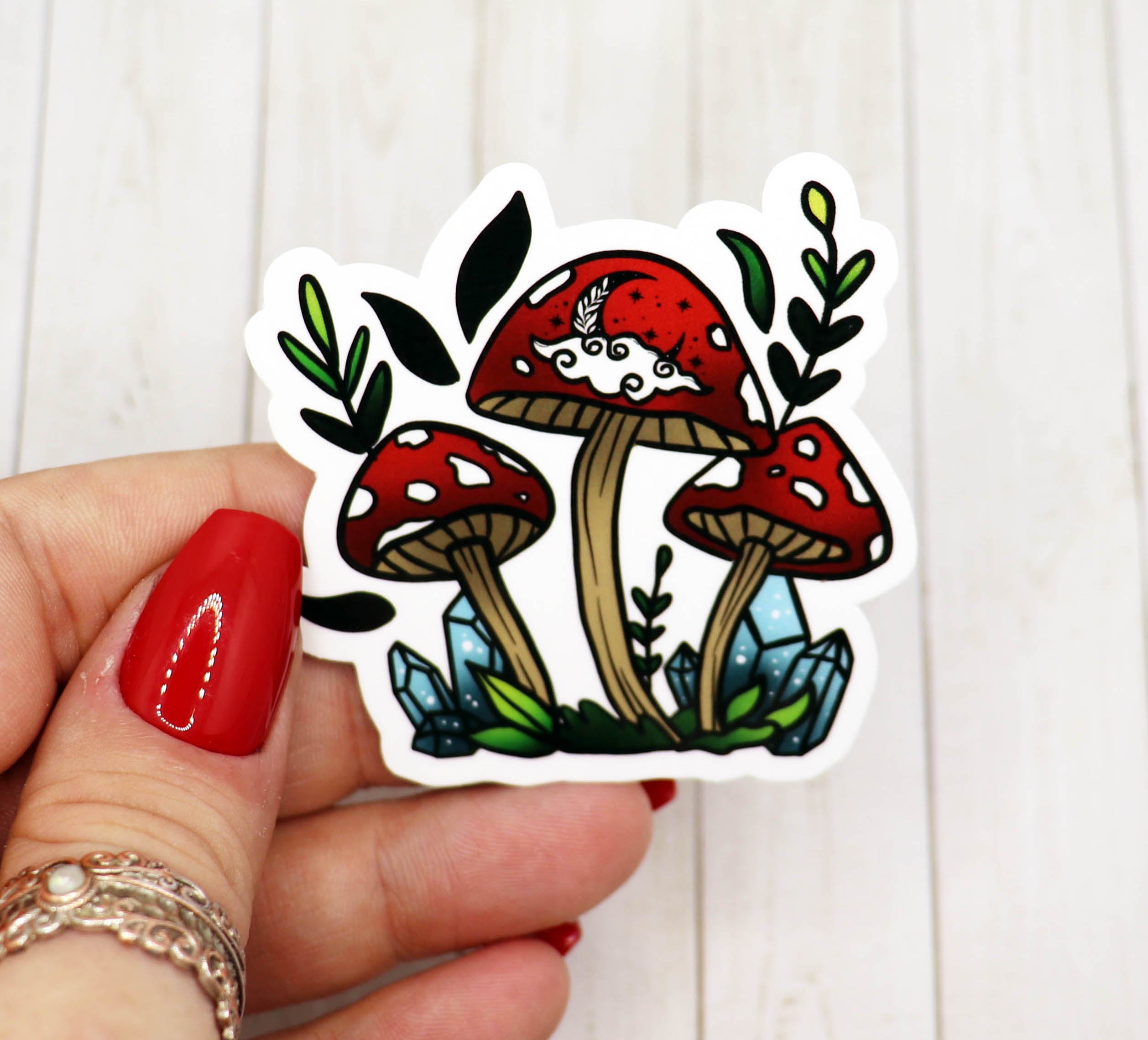 A vibrant red mushroom vinyl sticker on a white background, showcasing its intricate design and matte finish.