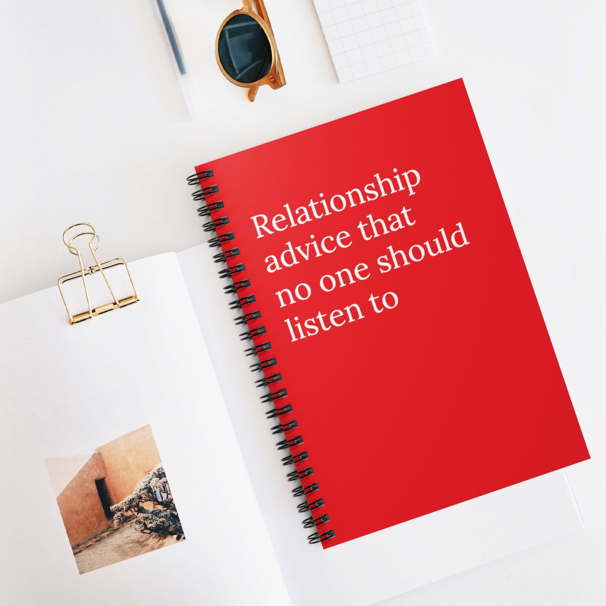 A spiral-bound funny notebook featuring humorous relationship advice, with a colorful cover design and 118 blank pages for writing.