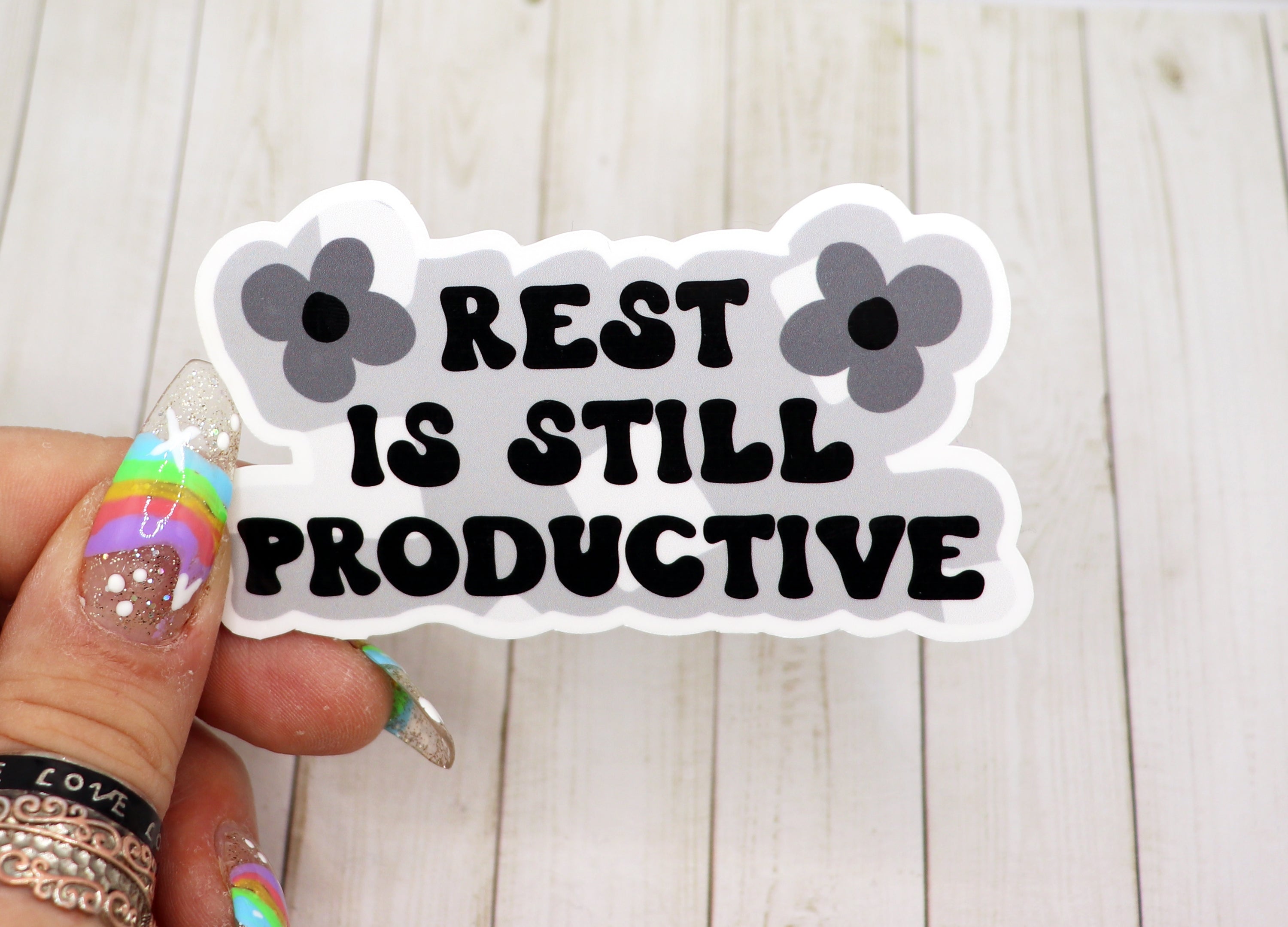 Rest Is Still Productive Vinyl Sticker on a white background, showcasing its matte finish and motivational design.