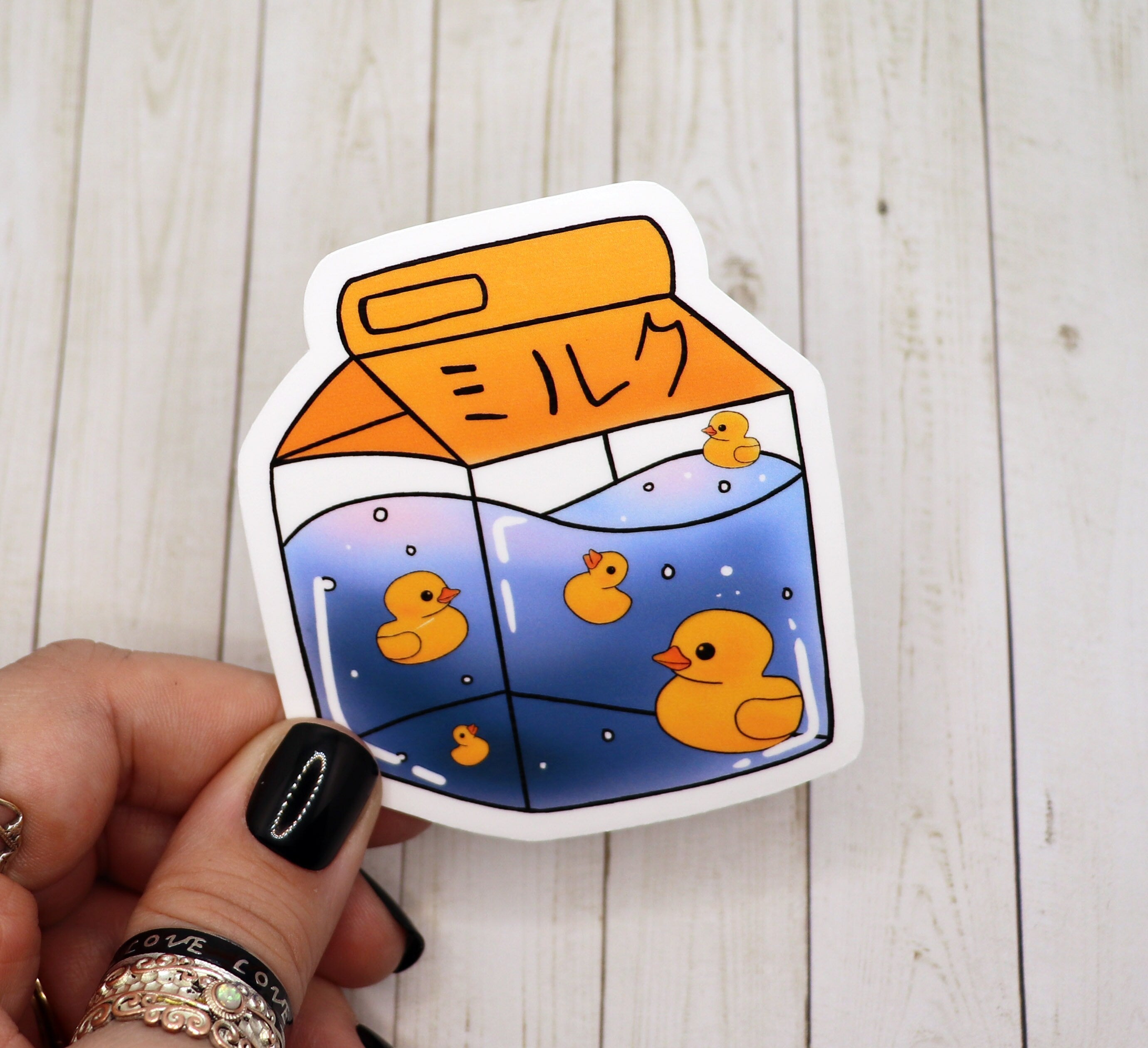 A vibrant Rubber Ducky Milk Carton Sticker on a white background, showcasing its playful design and high-quality matte finish.