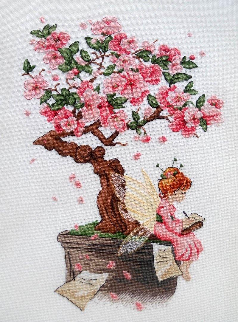 Sakura SNV-570 Counted Cross Stitch Kit featuring 18 count AIDA canvas, 24 colorful threads, and a needle, designed by Tatiana Kuzmina.