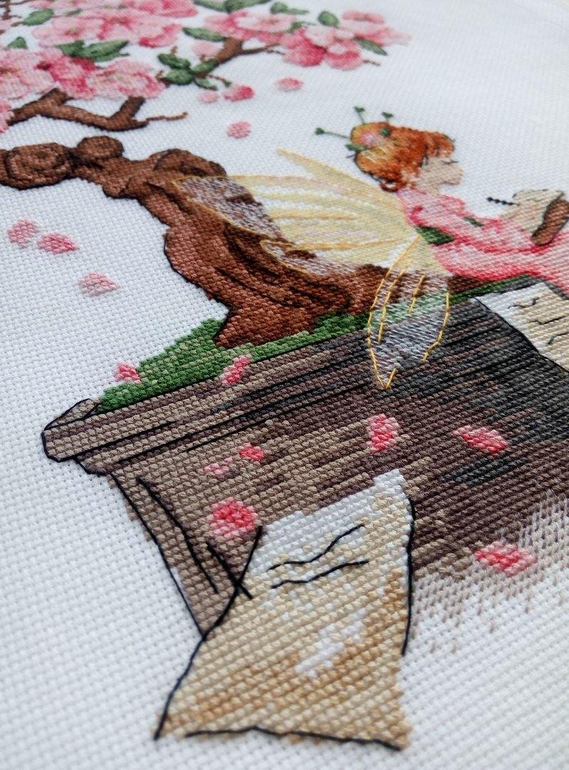 Sakura SNV-570 Counted Cross Stitch Kit featuring 18 count AIDA canvas, 24 colorful threads, and a needle, designed by Tatiana Kuzmina.