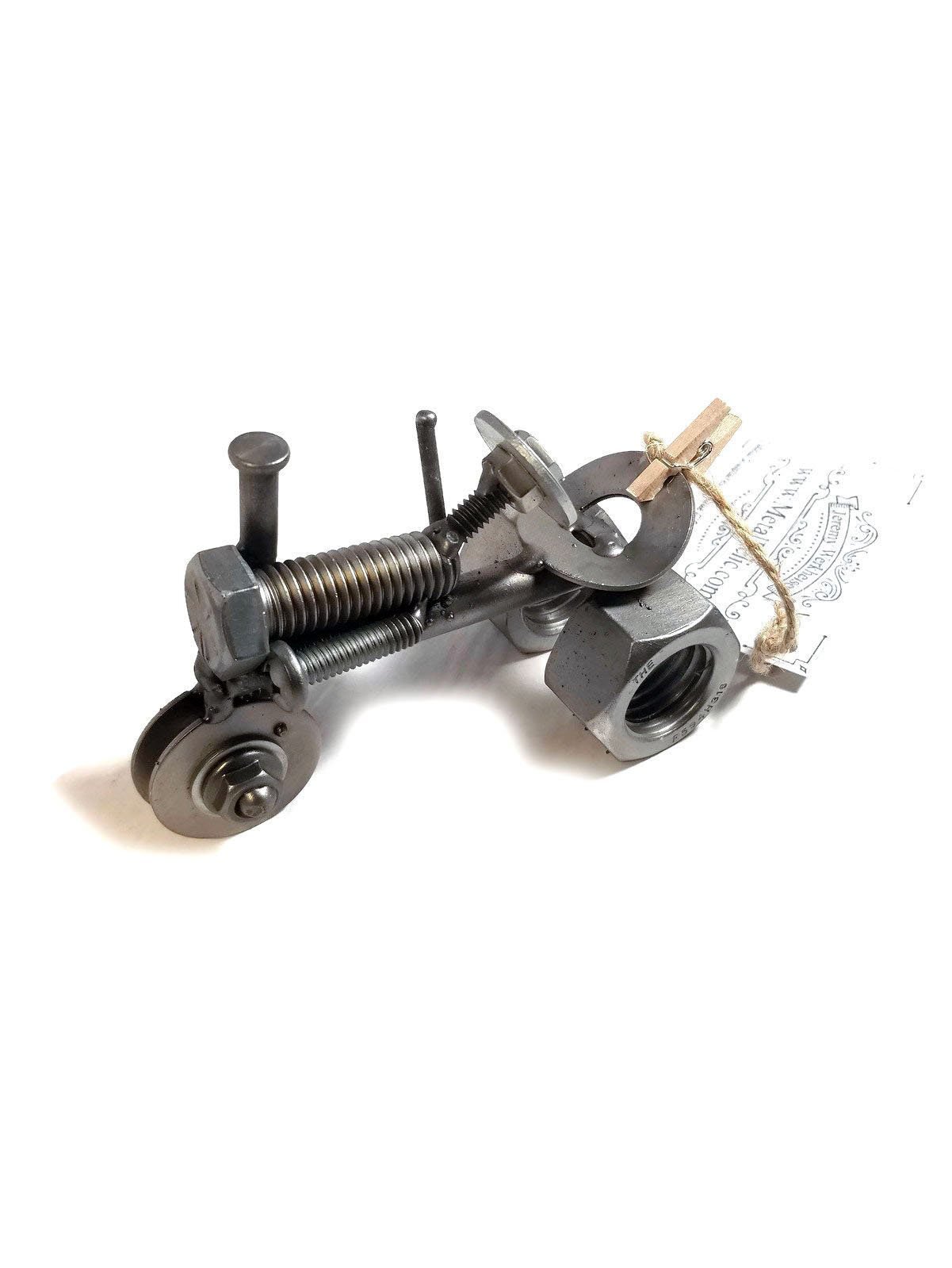 Handmade scrap metal tractor figurine crafted from nuts, bolts, and wire, featuring a rustic design with a protective finish.