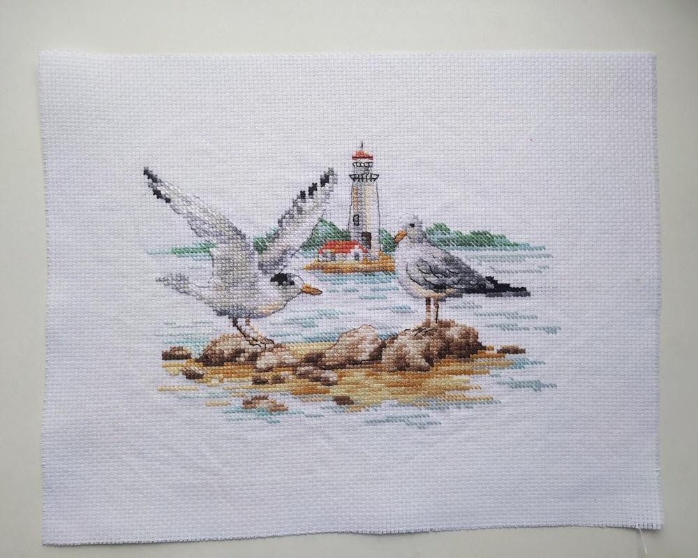 Seagulls 3-30 Cross-stitch kit featuring white aida fabric, colorful threads, and an embroidery needle.